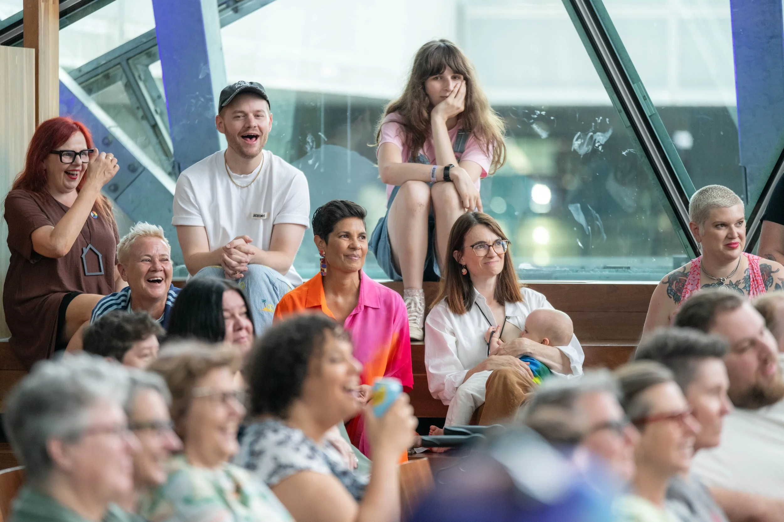 Humans look on and laugh.