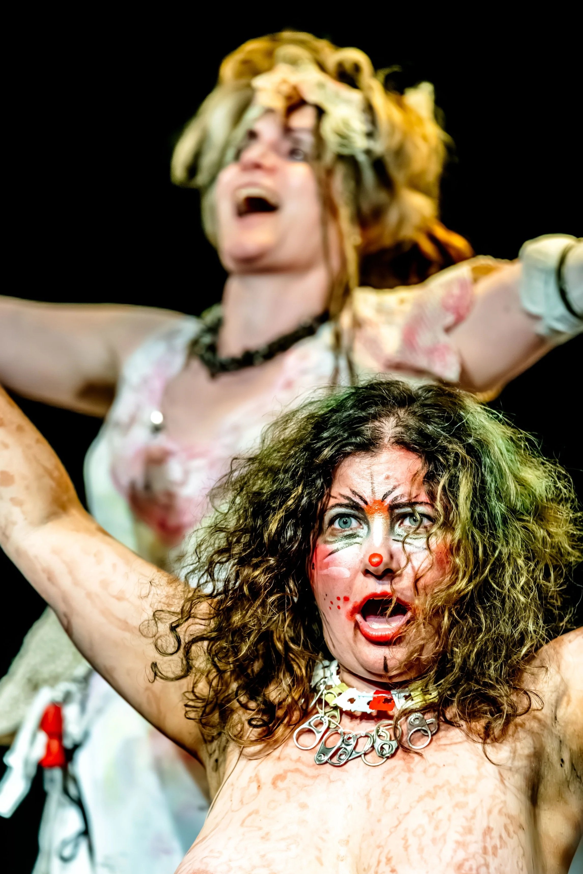 Both Jessie Ngaio and Sian Horrocks raise their arms in tribulation.