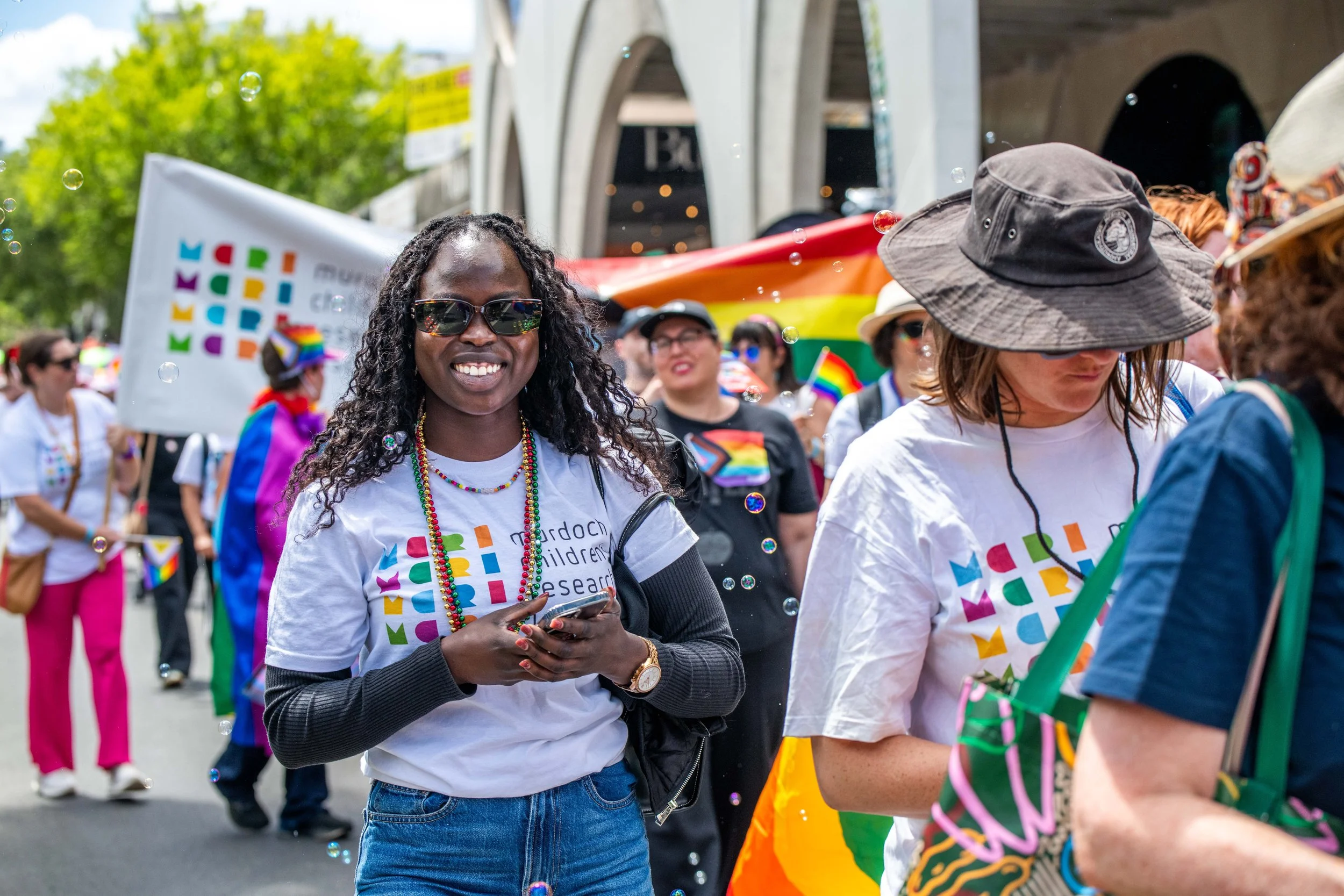 A human in sunglasses smiles for the camera.