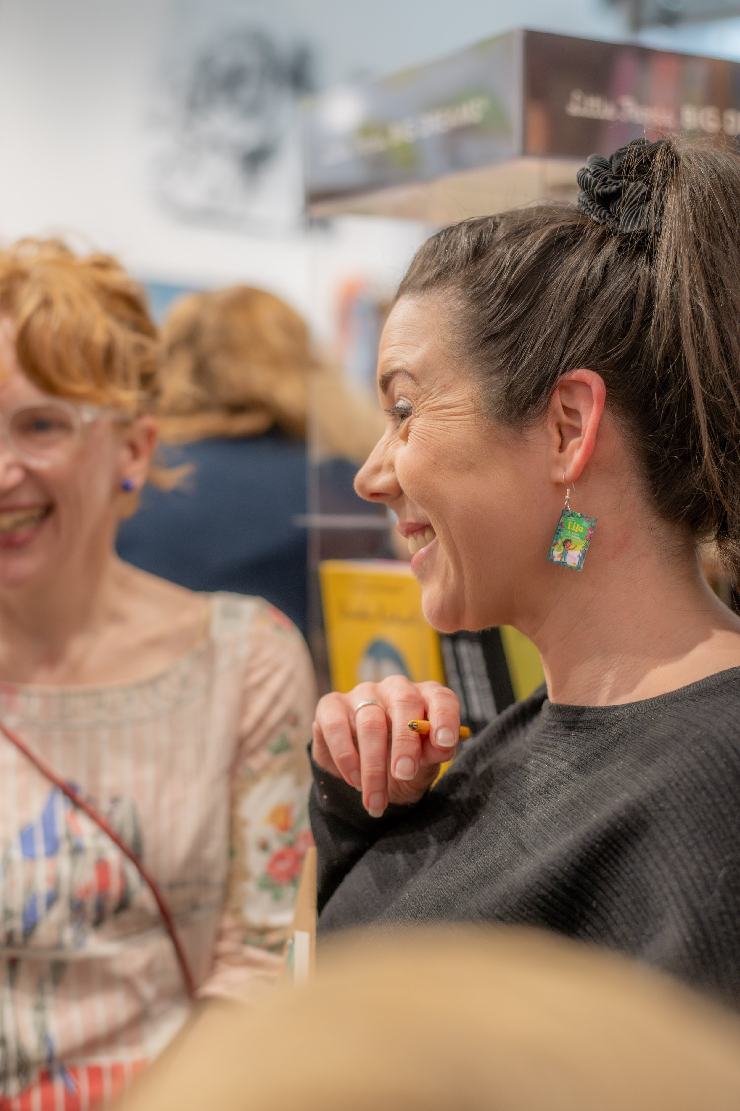 People stand around smiling.