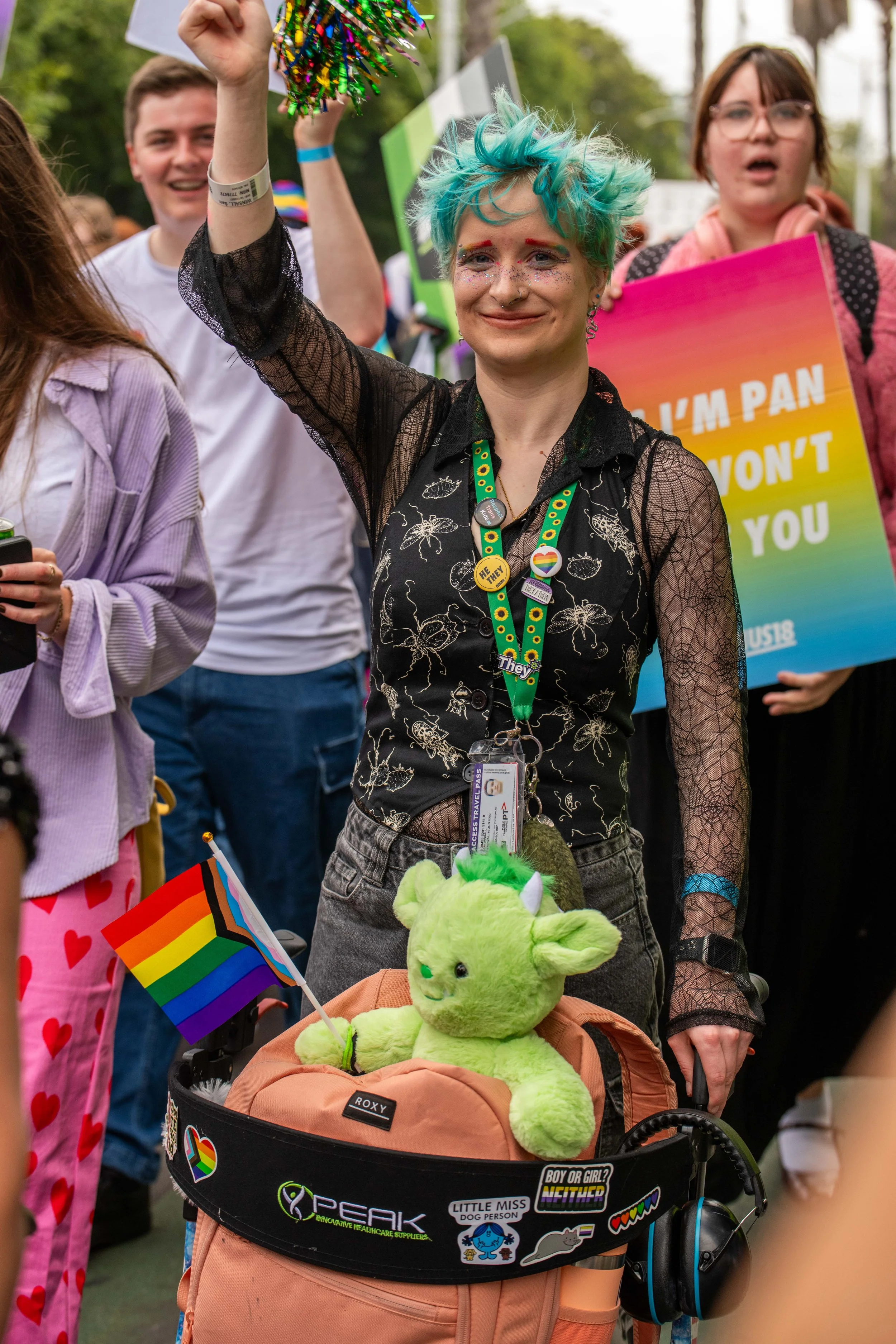 A human wearing a sunflower lanyard.