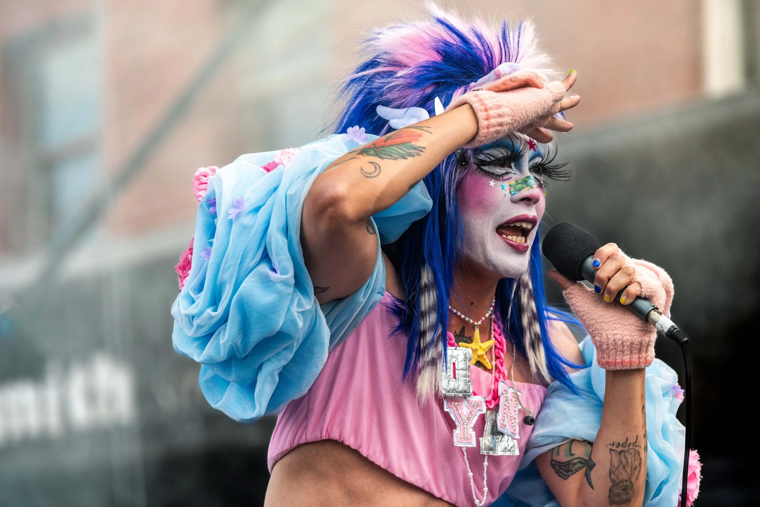 Dyan Tai looks out at the crowd as they sing.