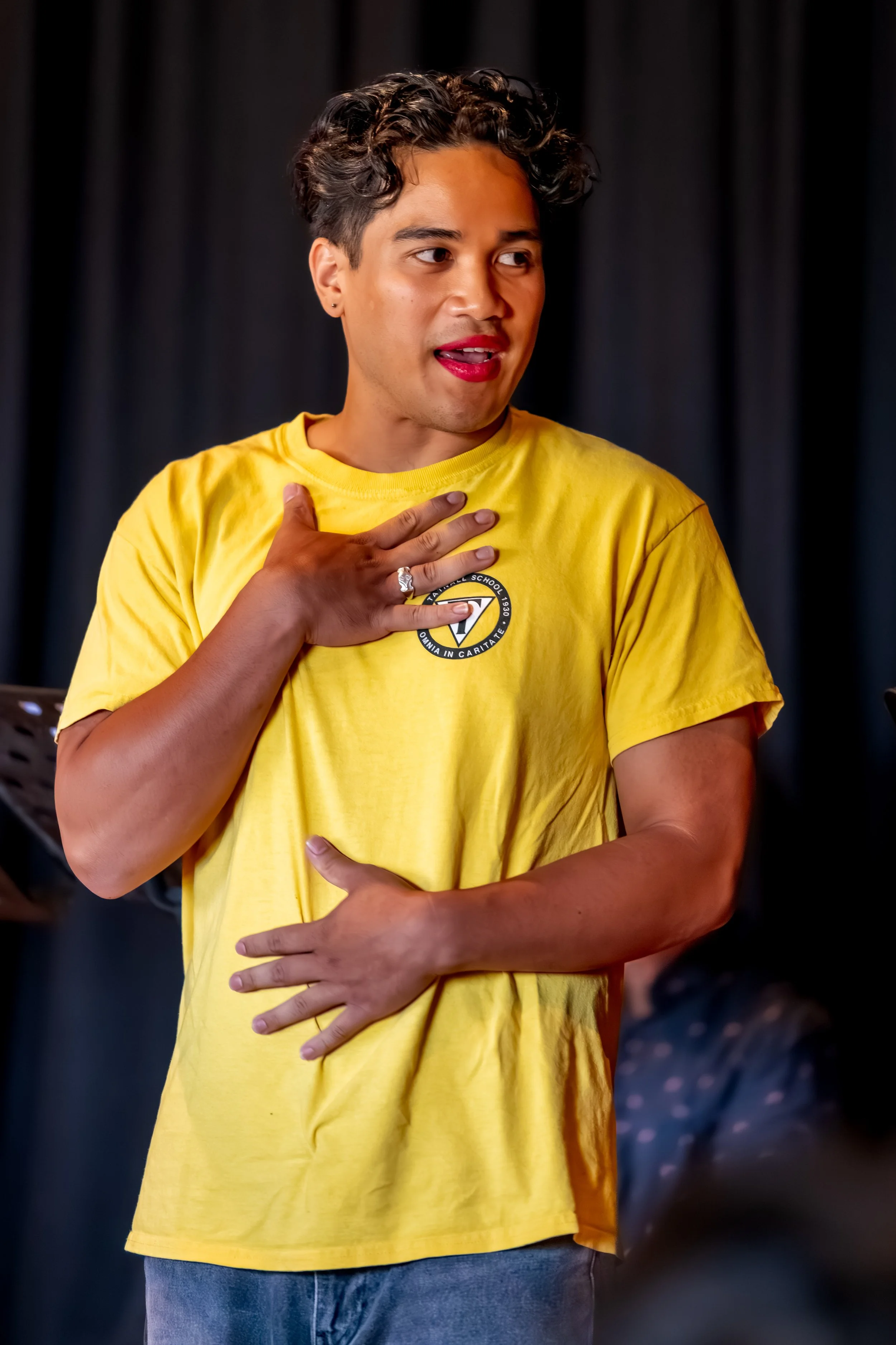 A human holds one hand to their chest, another to their stomach.