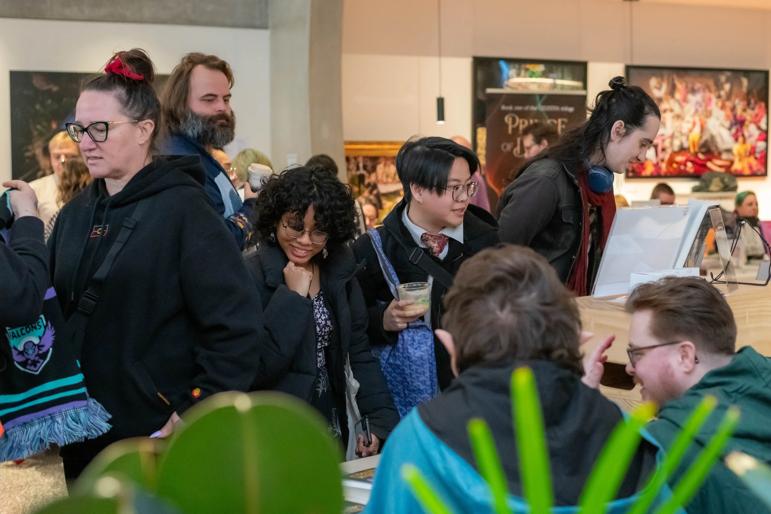 A large crowd of humans perusing book stalls.