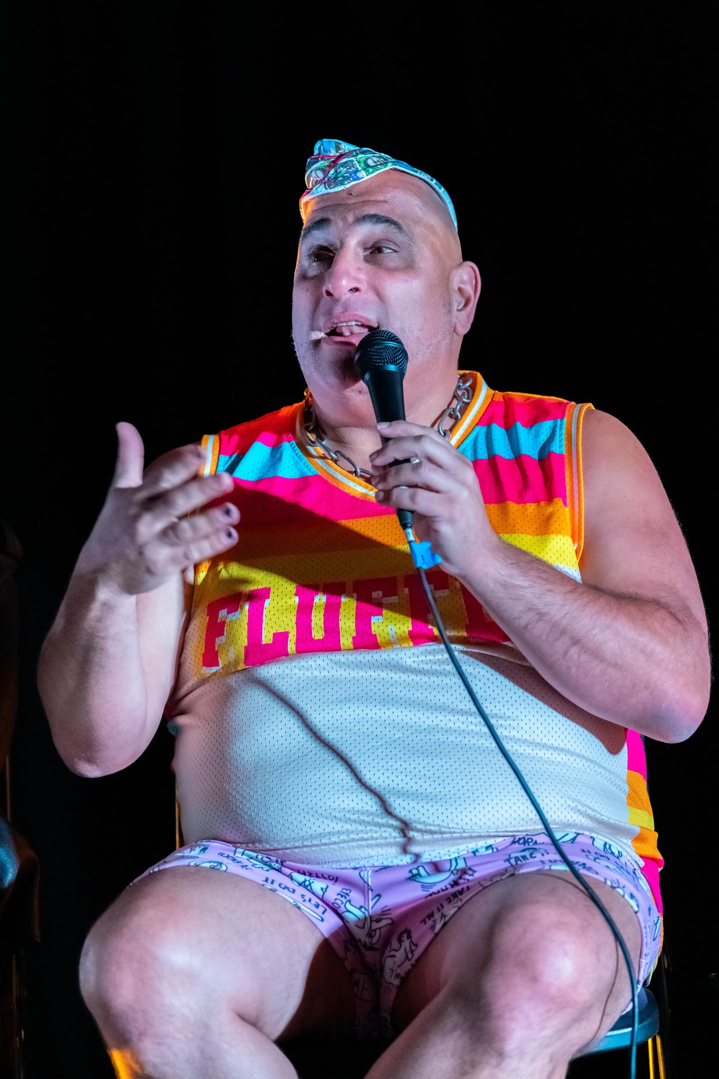 Dean Arcuri speaking into a microphone.