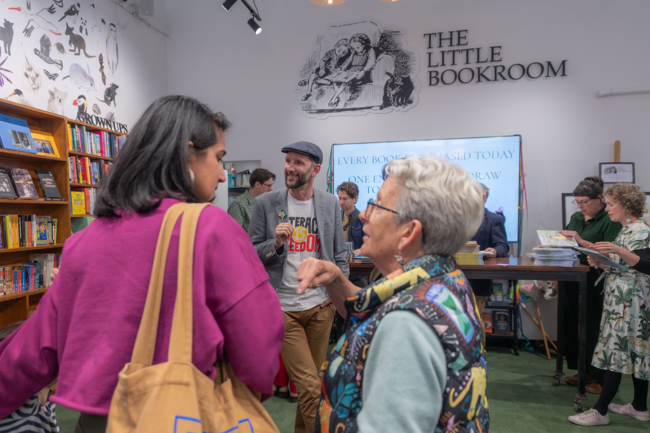 People mingle and chat to each other.