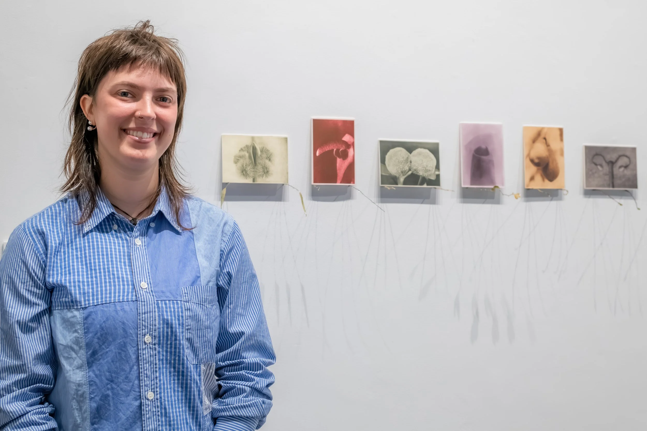 An artist with their artwork.