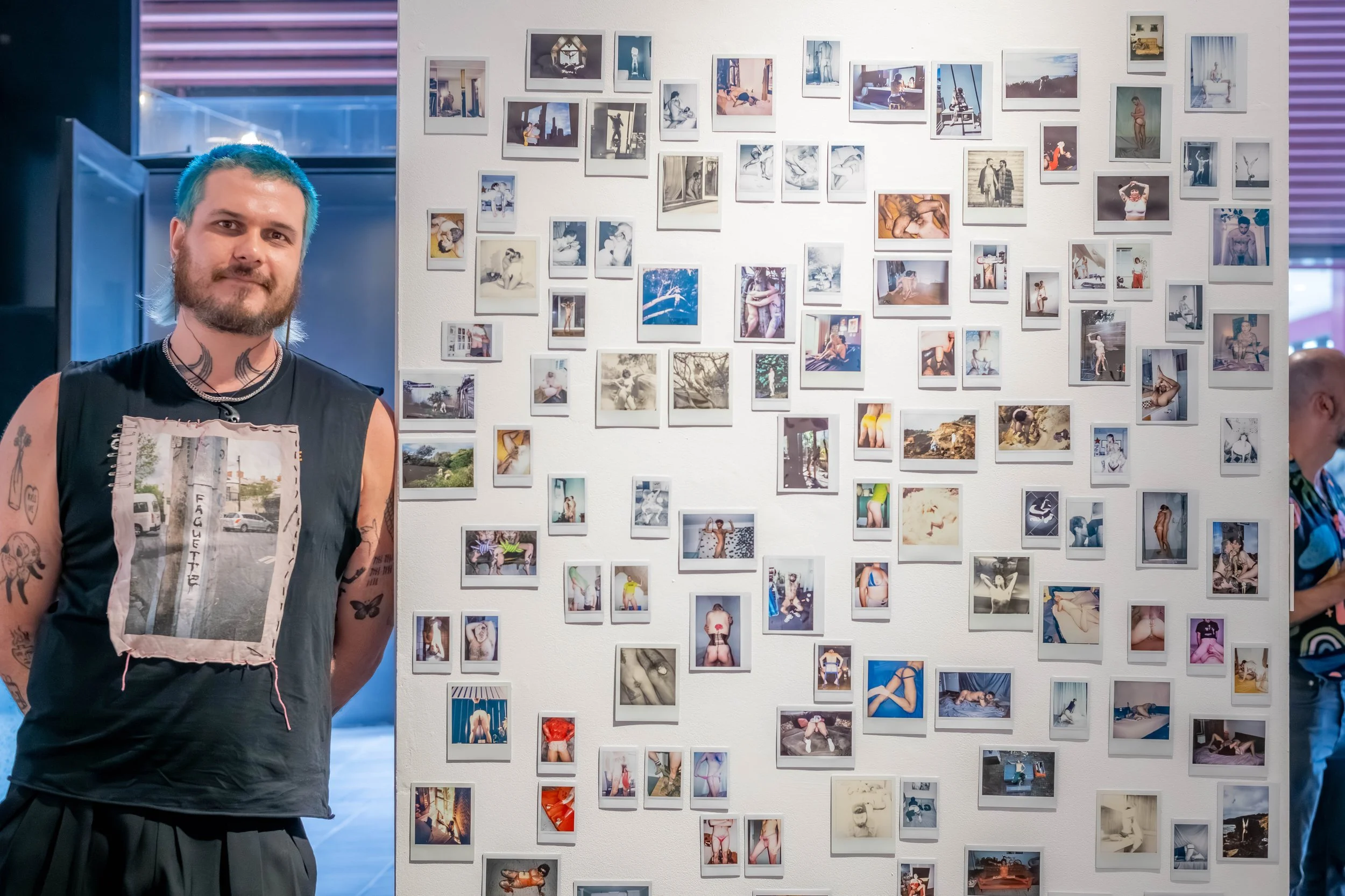 An artist with their artwork.