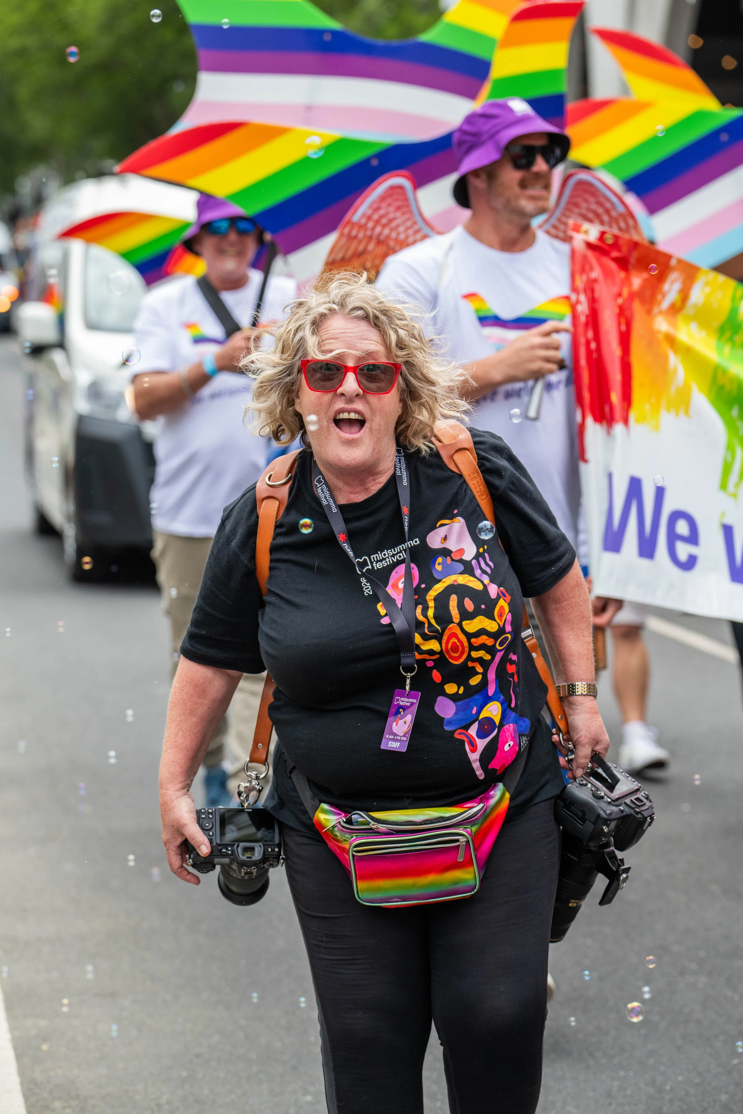 A Midsumma photographer posing for the camera with their mouth open.