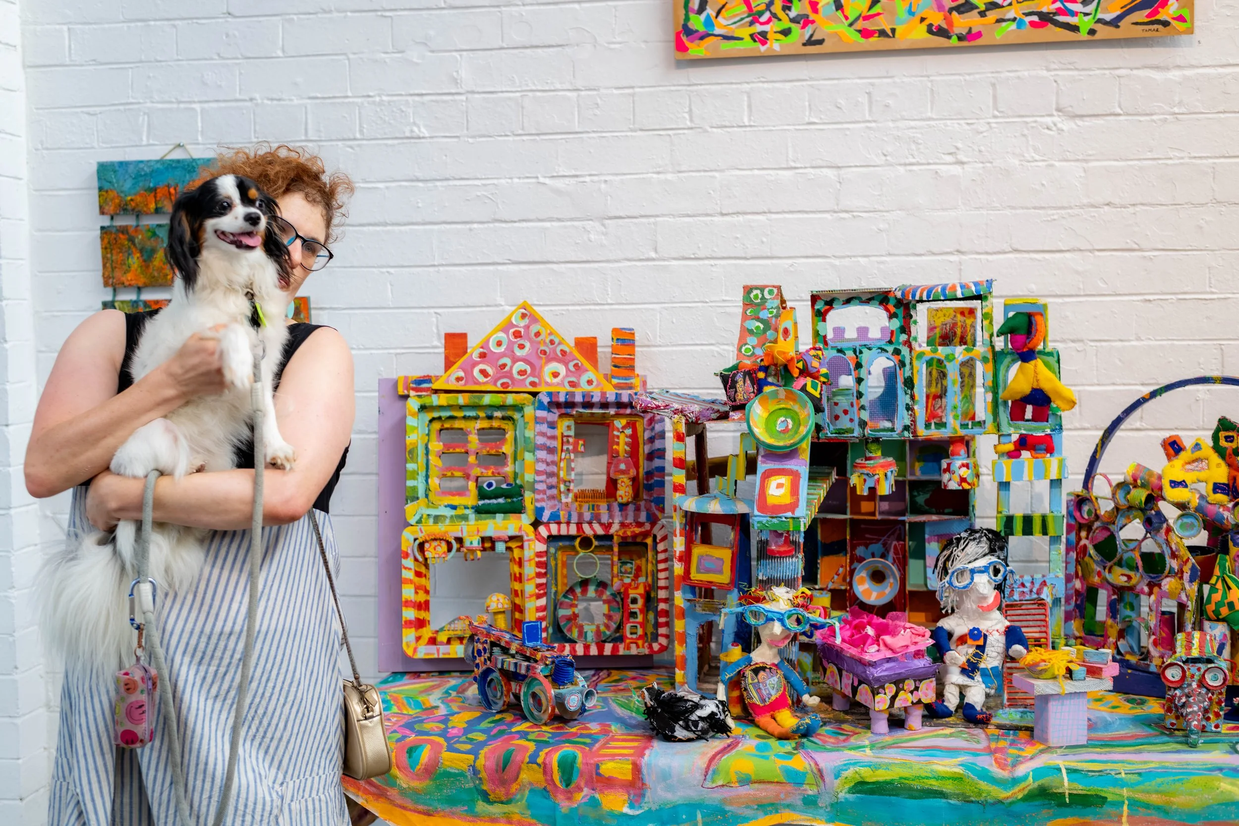 Tamar Dolev poses next to their sculpural work.