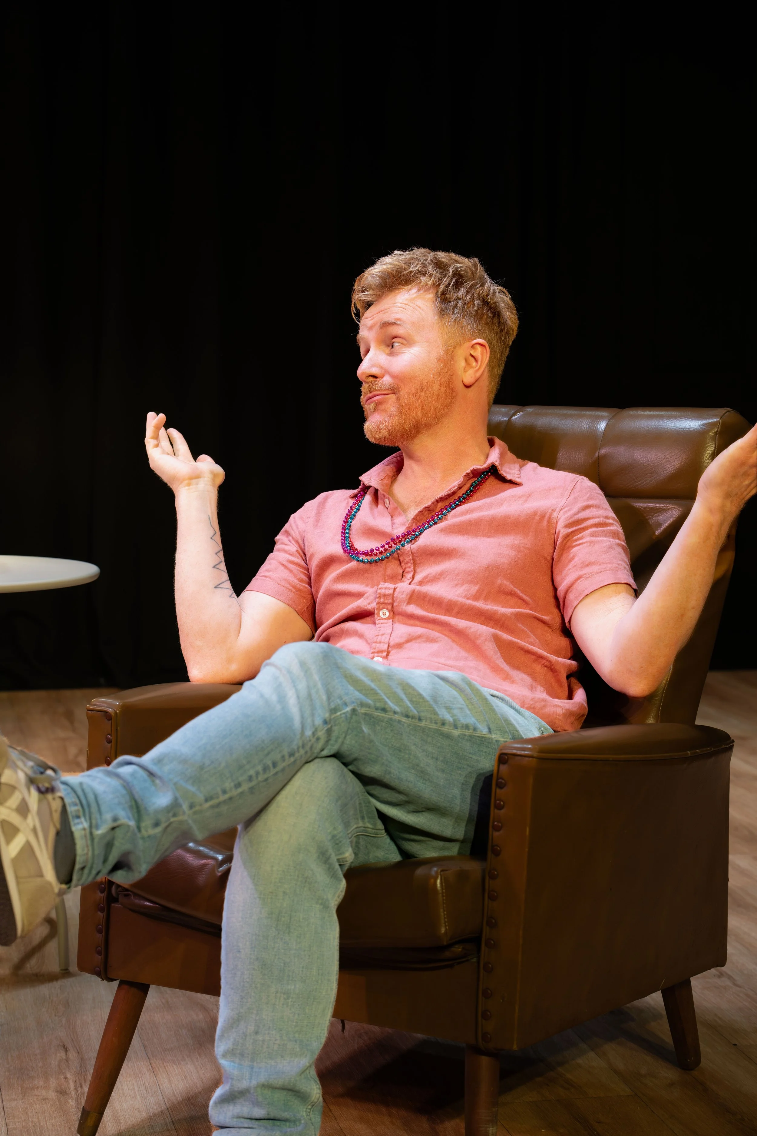 A human gesticulates with their hands out.