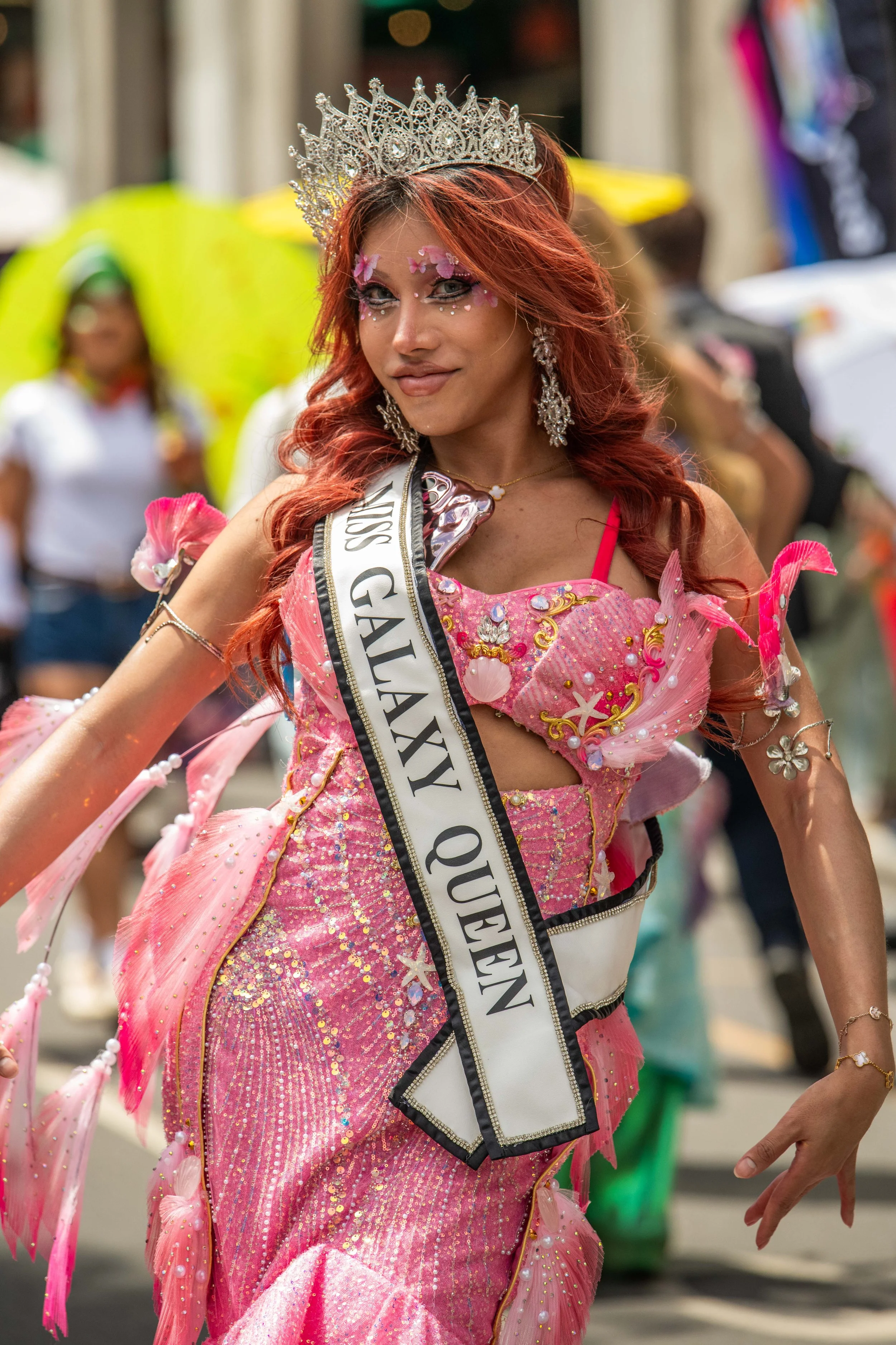 Miss Galaxy Queen in a pink dress.