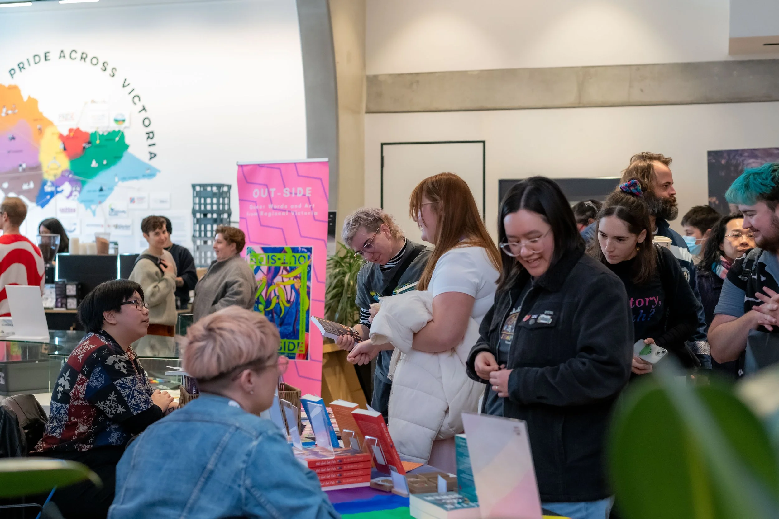 A large crowd of humans perusing book stalls.