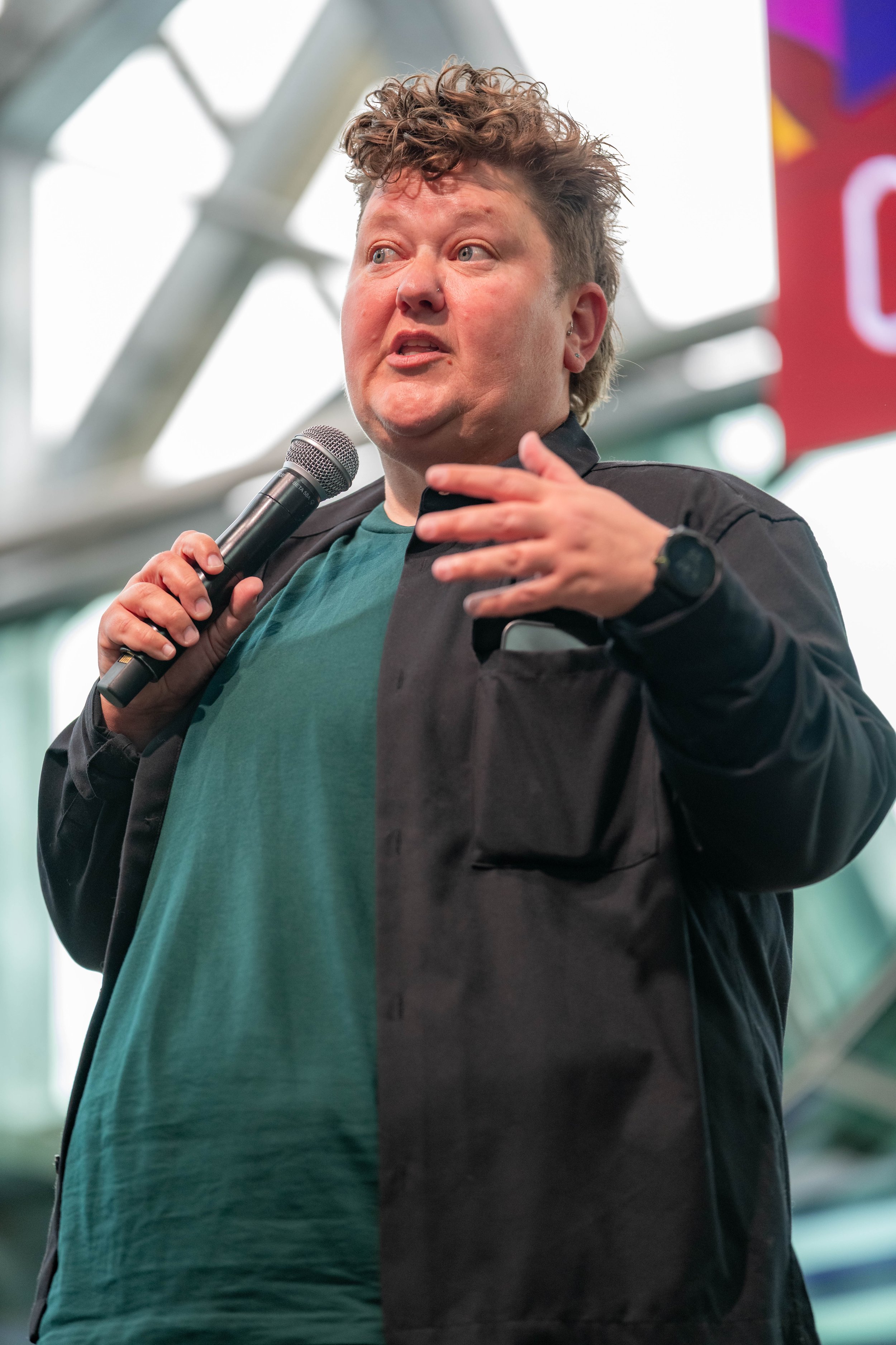 Kirsty Webeck talks into a microphone.