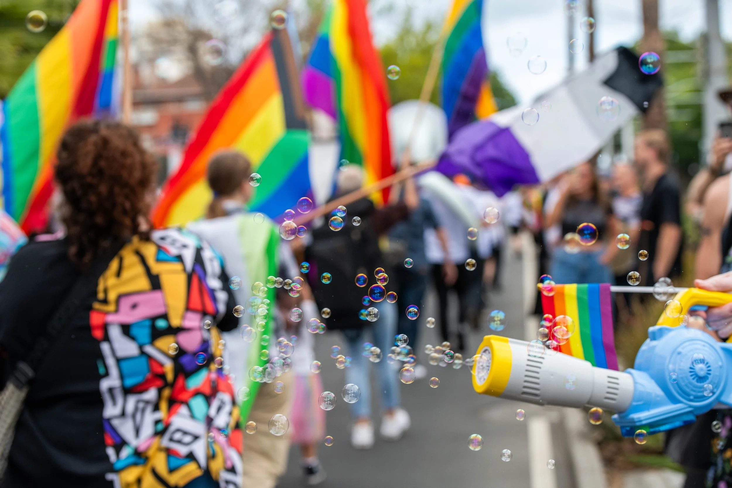 Bubble gun blowing bubbles at marchers.