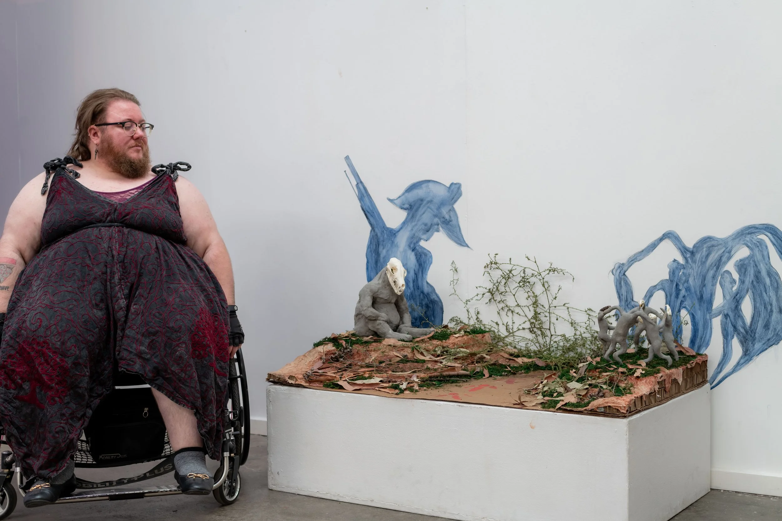 Bramble Karvinen with their sculpture.