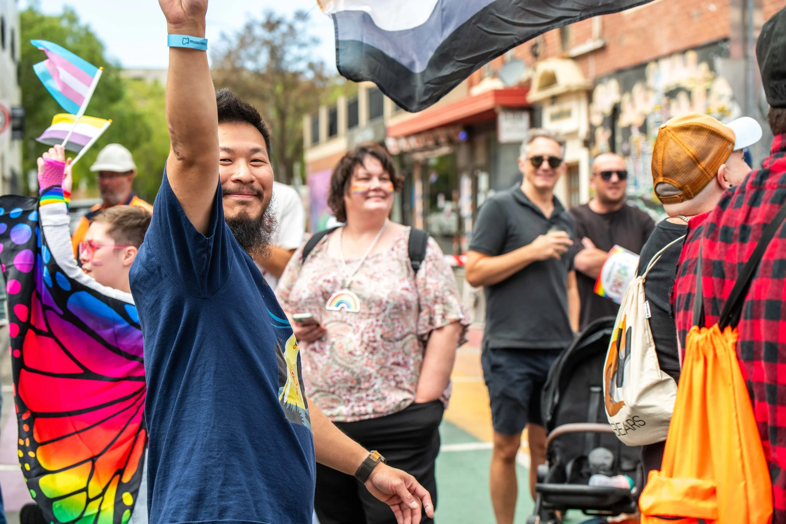 A human waves at the camera.