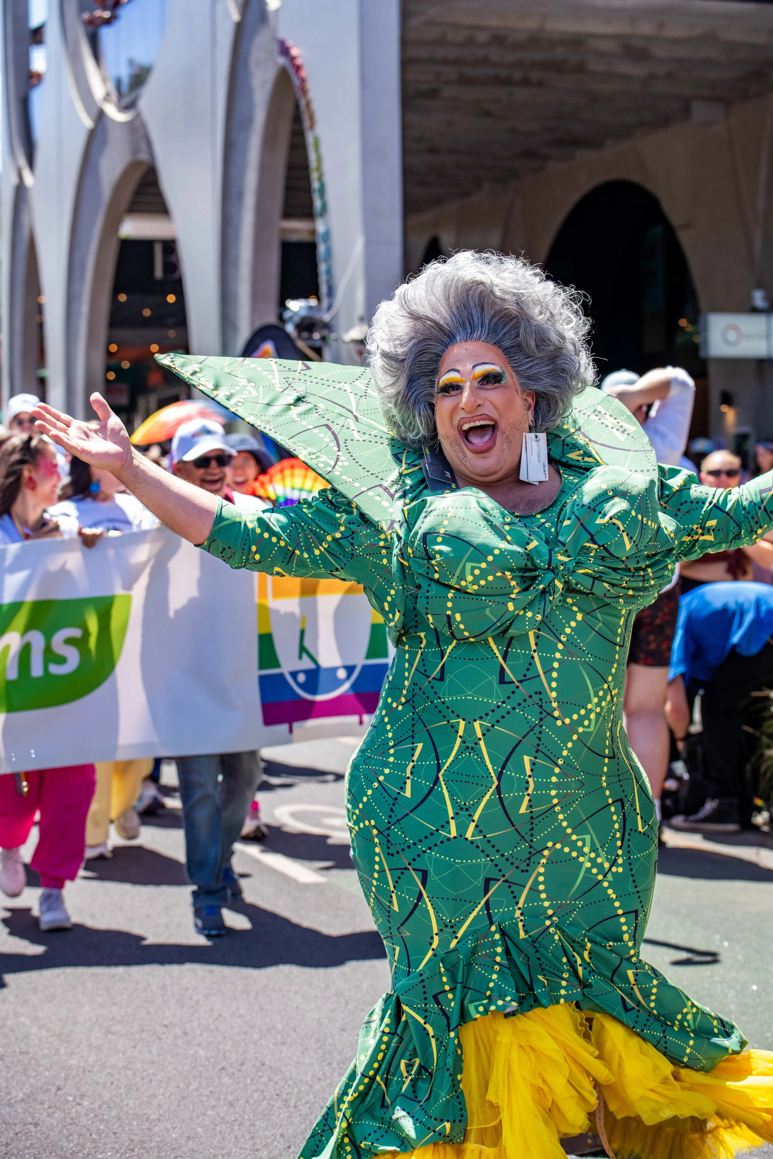 Drag Queen Frock Hudson outstretches their arms.