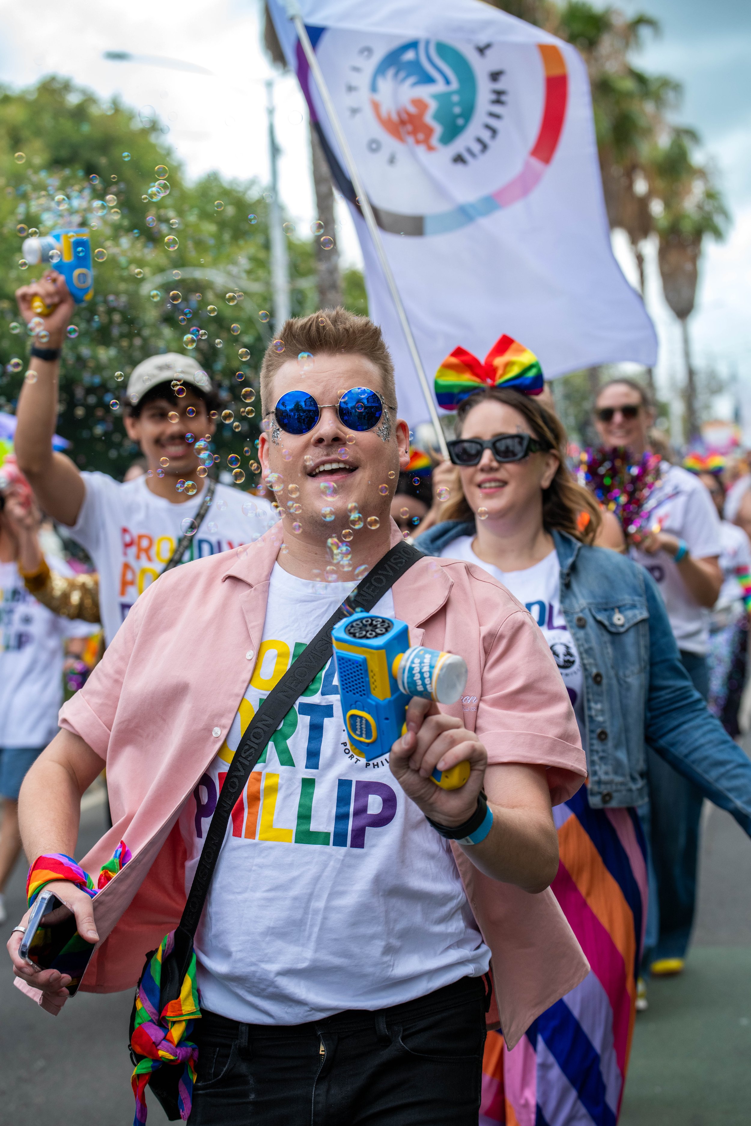 Human with a bubble gun marching.