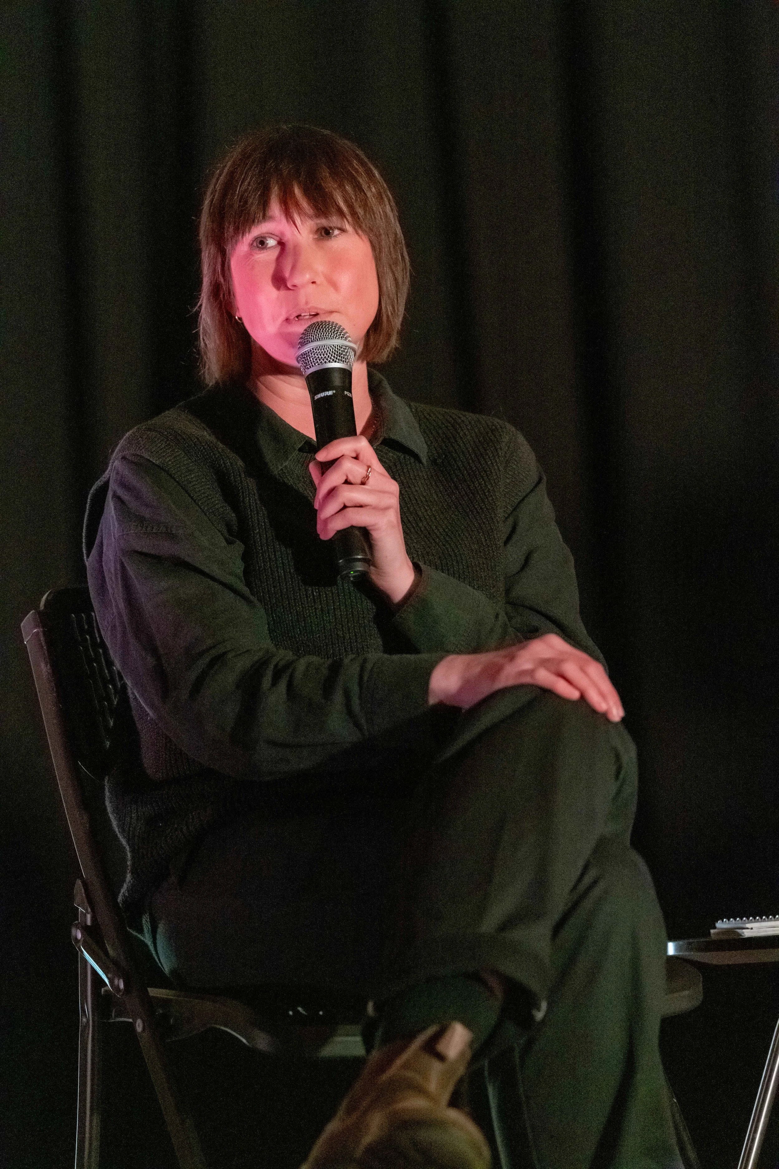 Amy Middleton sits and speaks into a microphone.