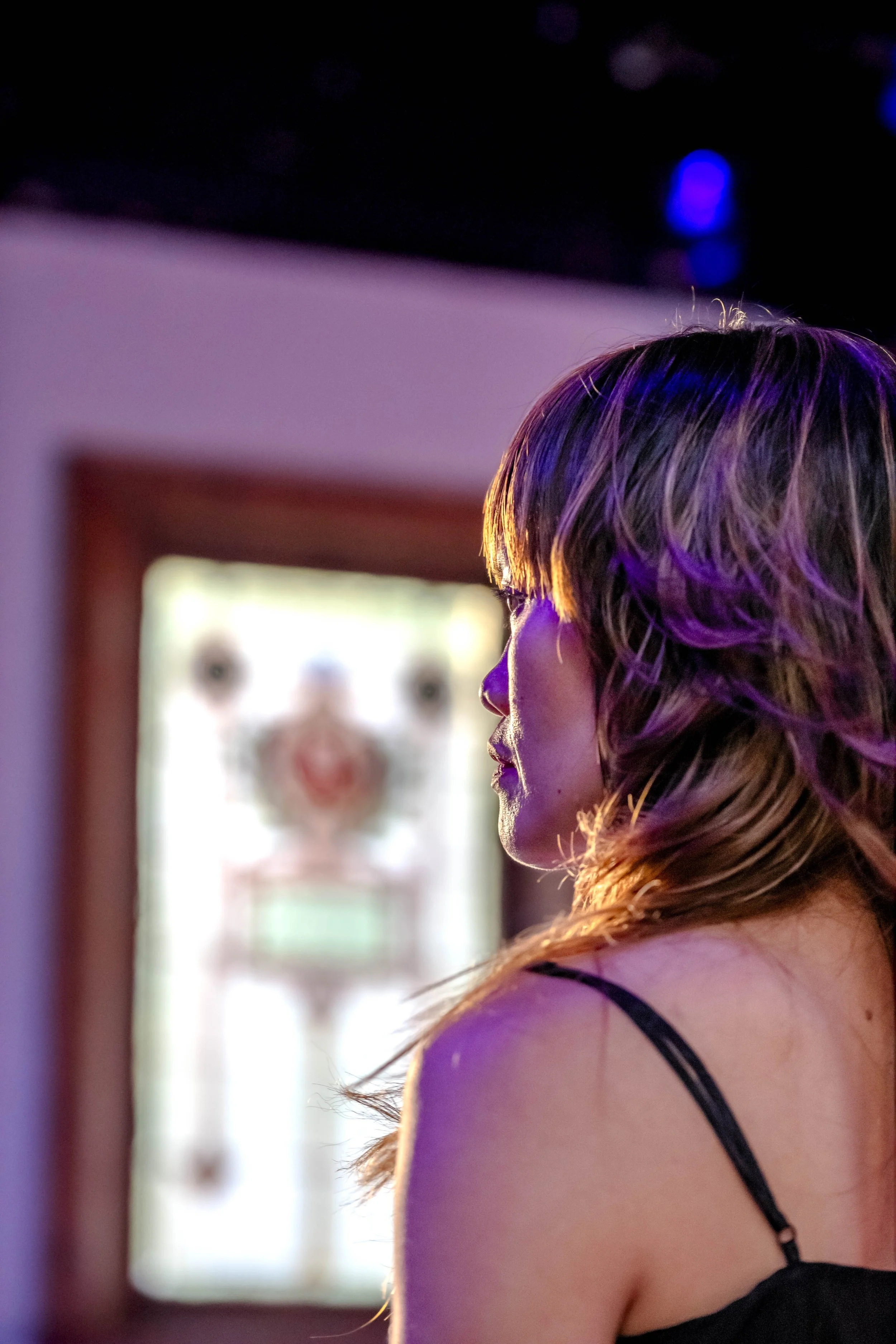 A close up of a performer in a black top.
