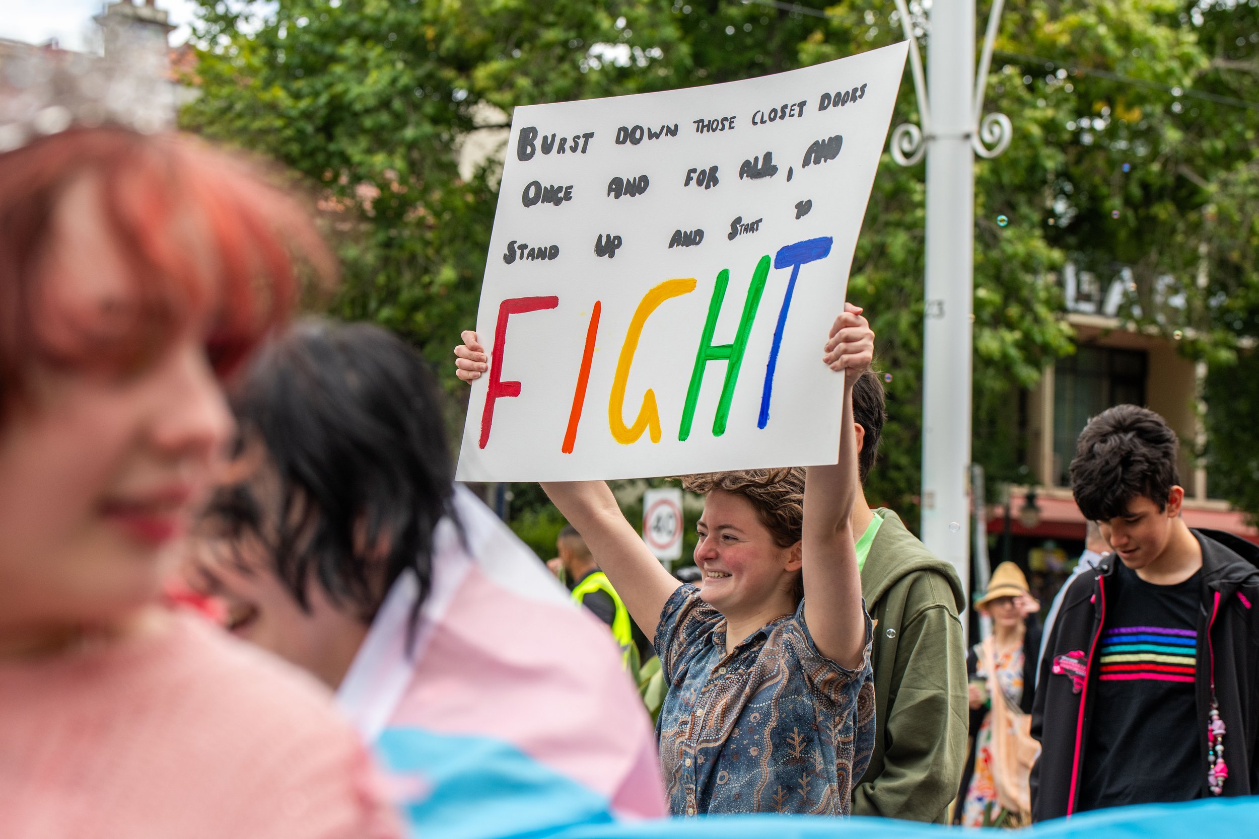 A human holding up a placard.
