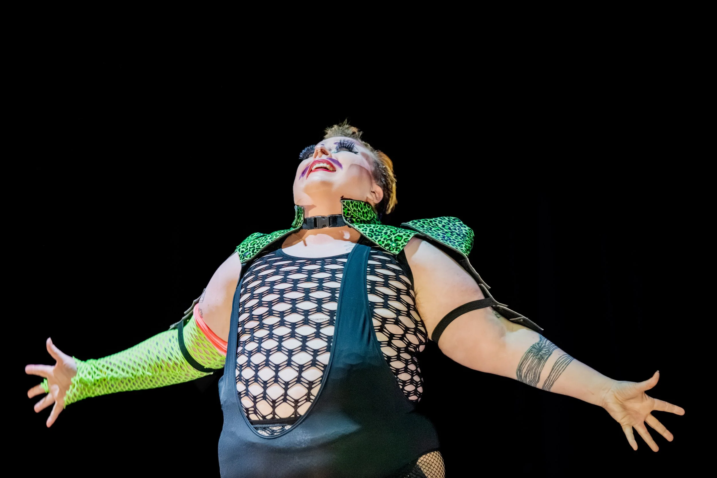 Jesse Dean splays their arms out wide.