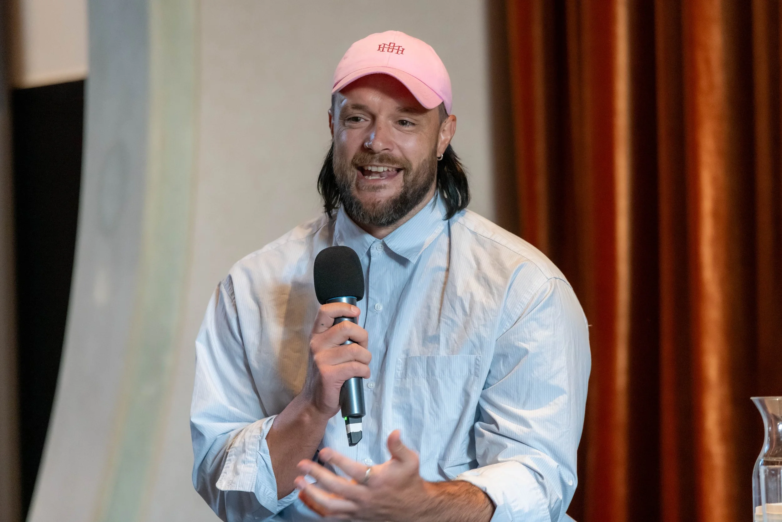 Mitch Brown speaks into a microphone.