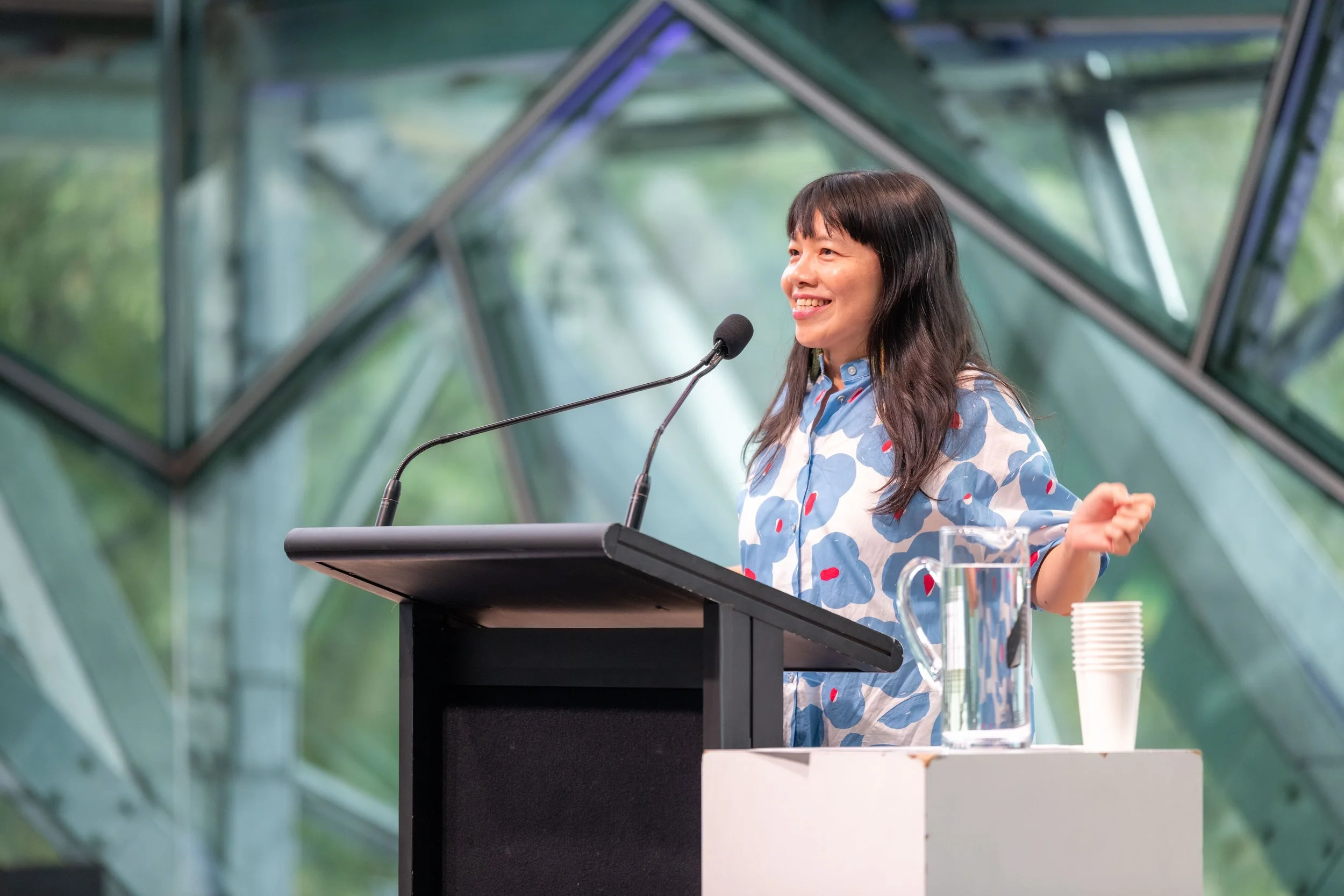 Dr Ee Ling Quah smiles and stretches out an arm.