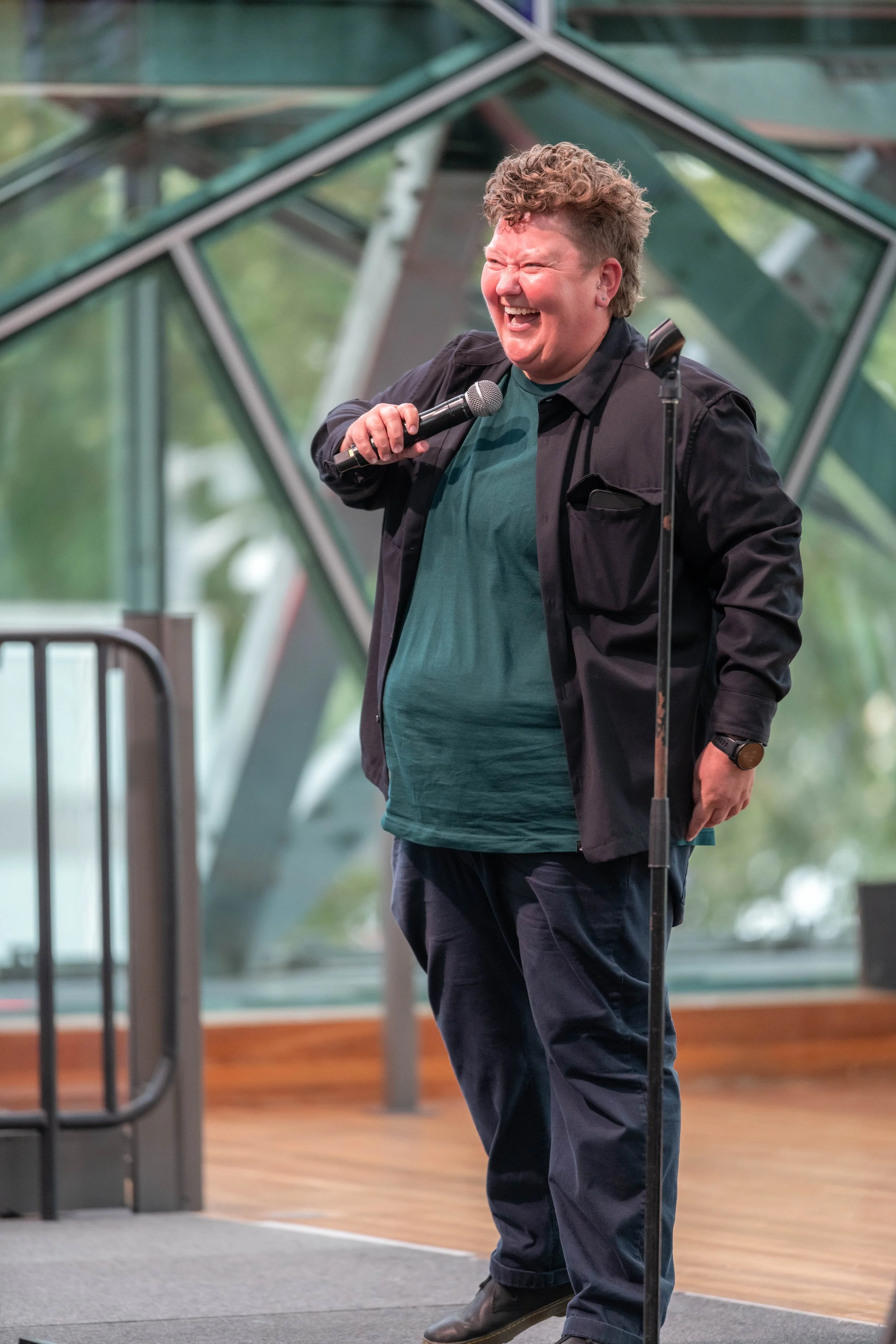 Kirsty Webeck laughs into a microphone.