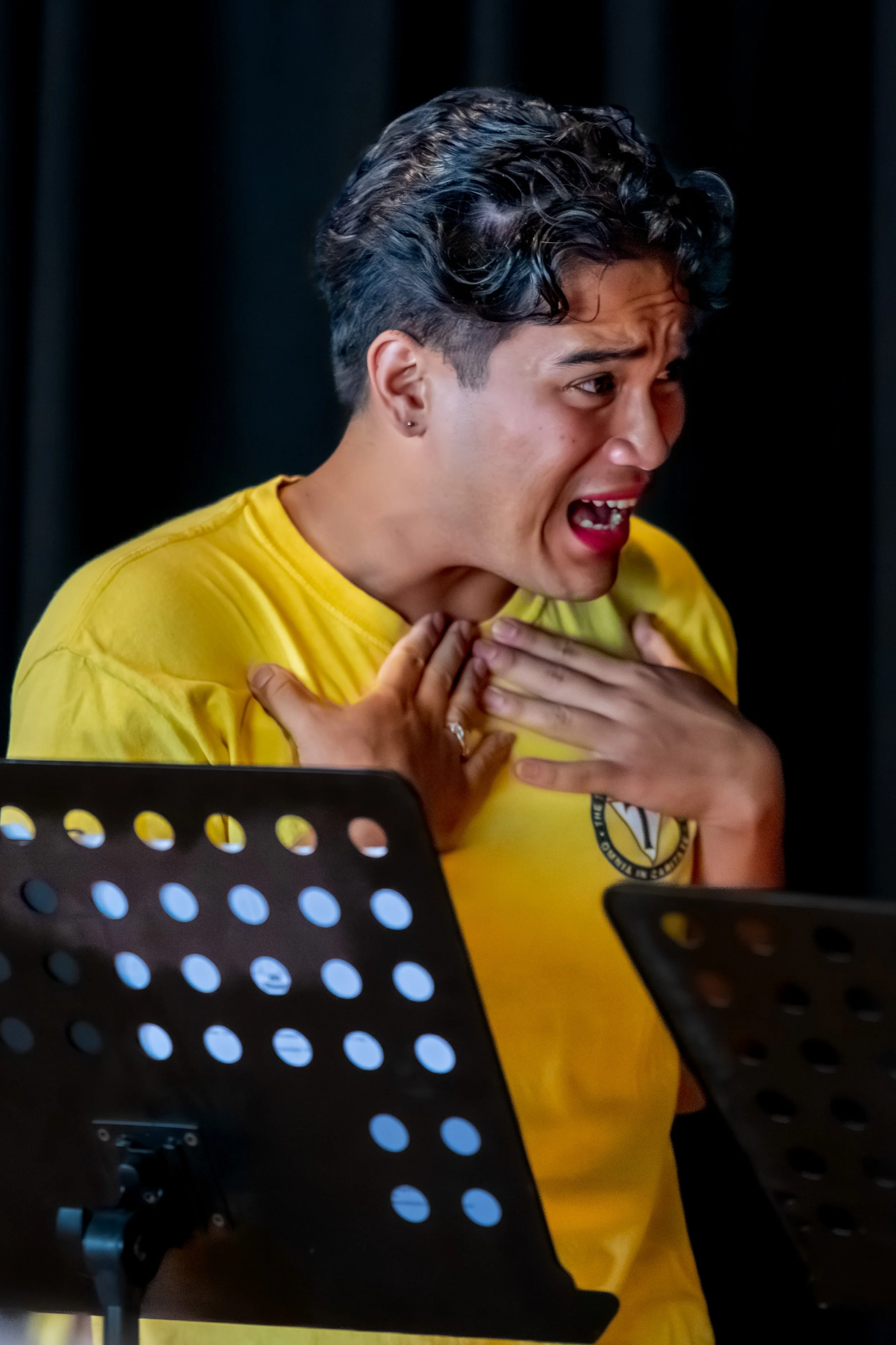 A human holds their hands to their chest.