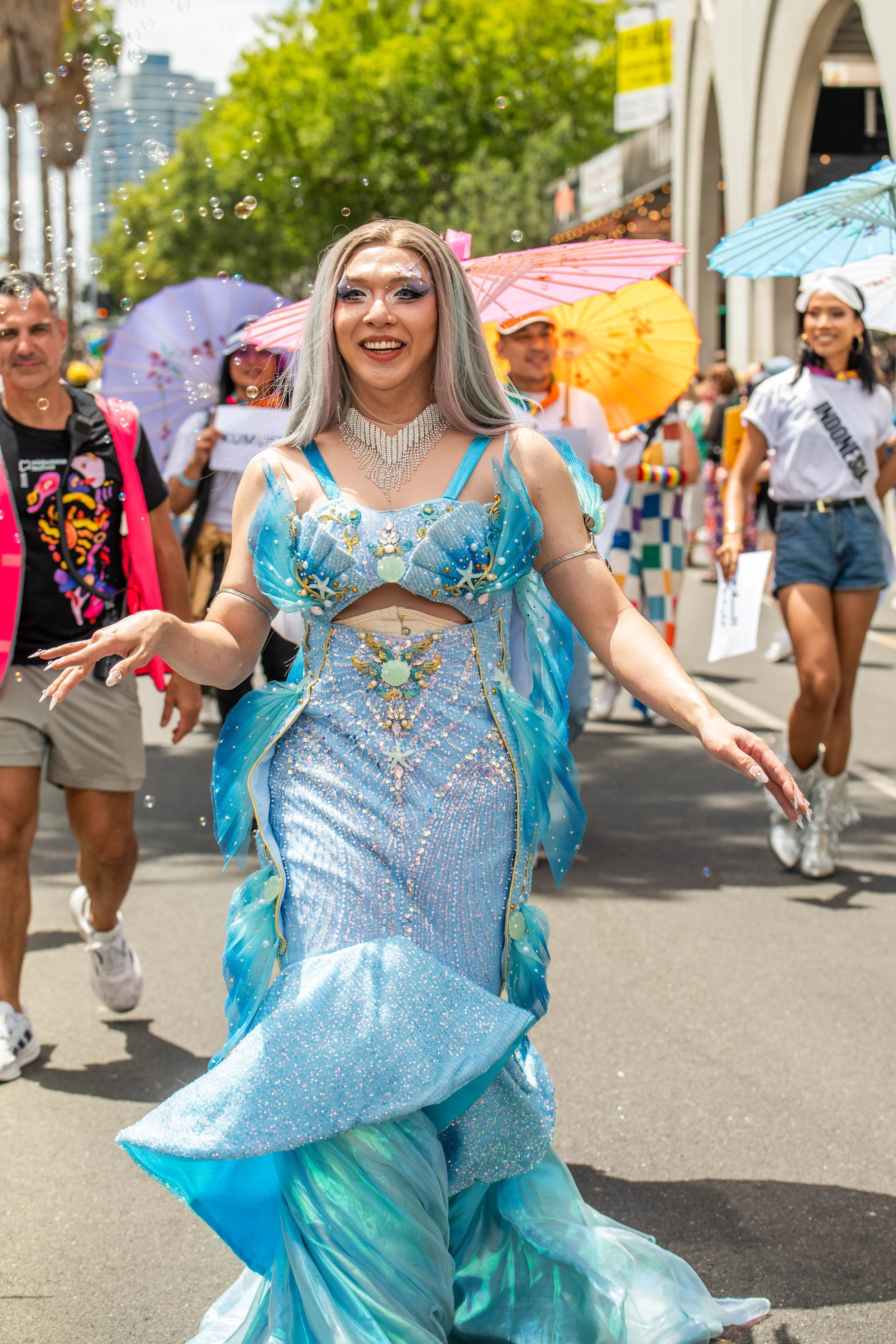 A human wearing a turquoise blue dress.