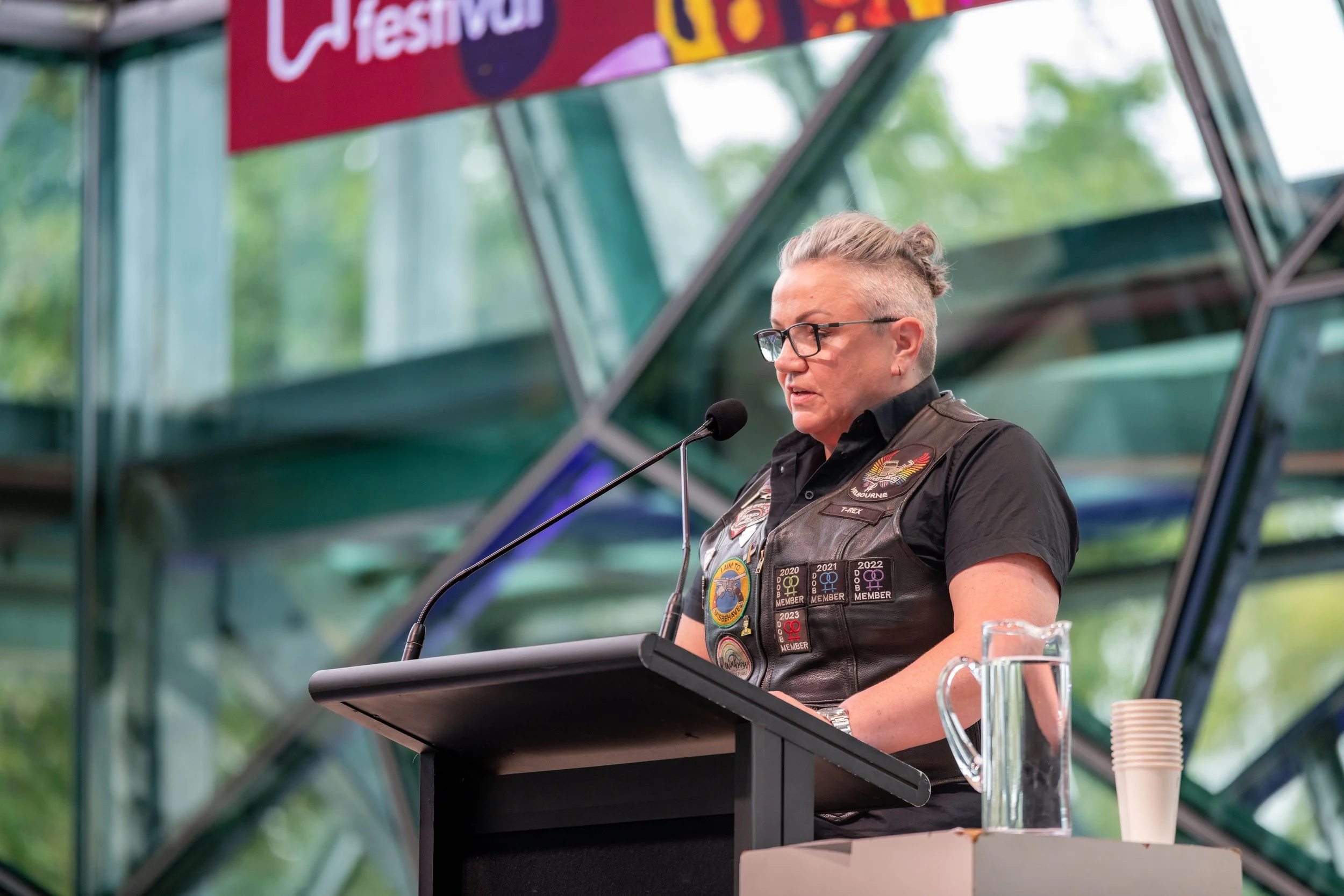 T-Rex speaks into a microphone.