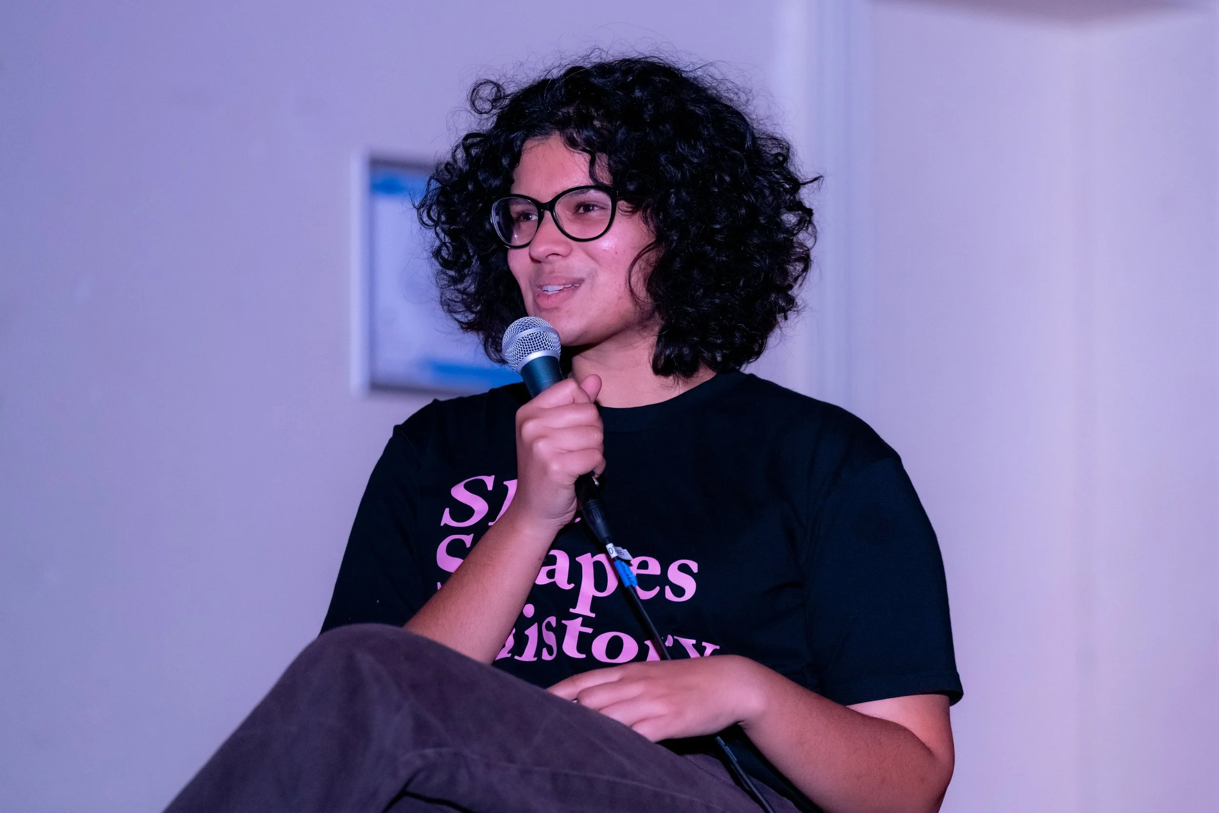 Sita Sargeant speaks into a microphone.