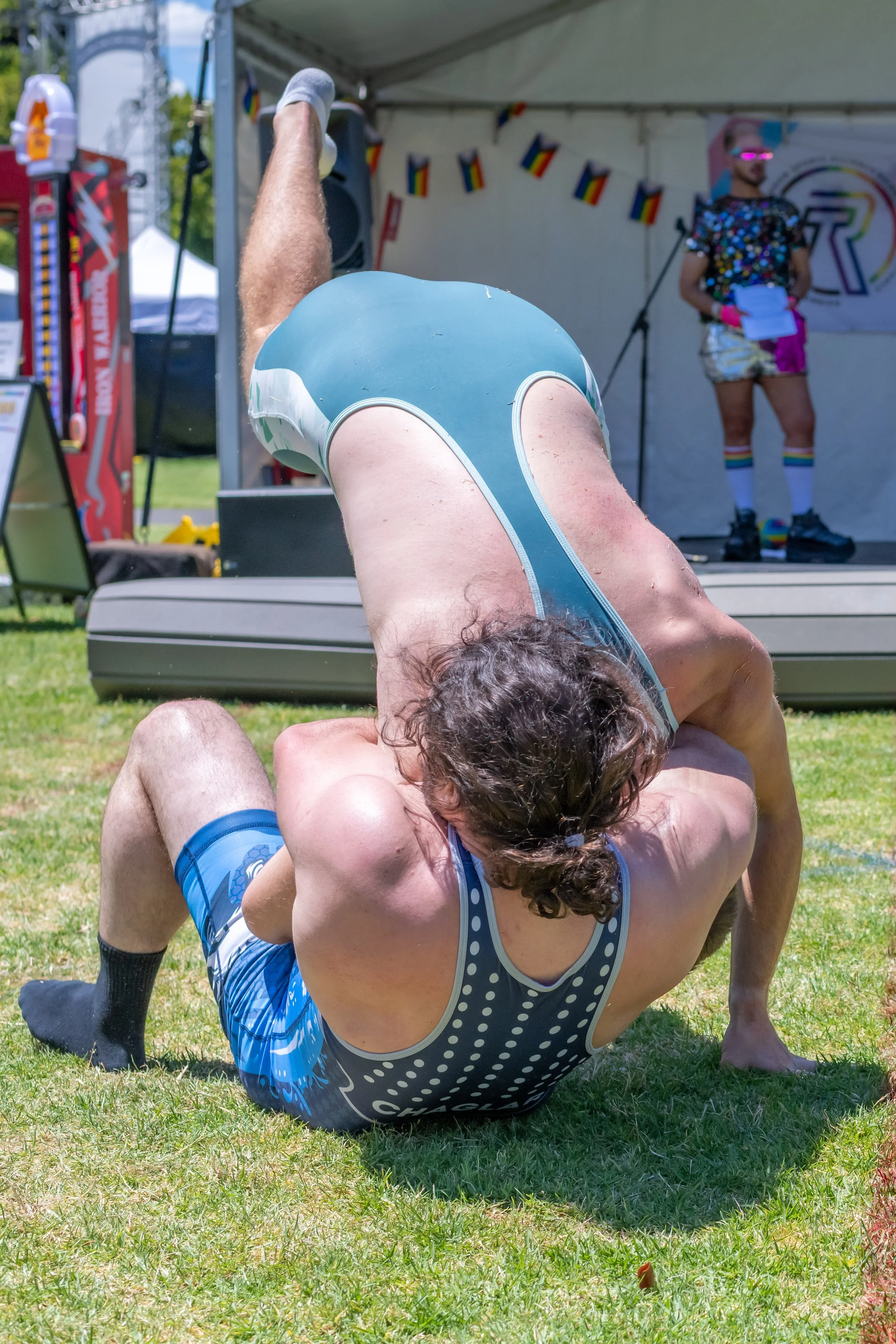 Two wrestlers mid throw.