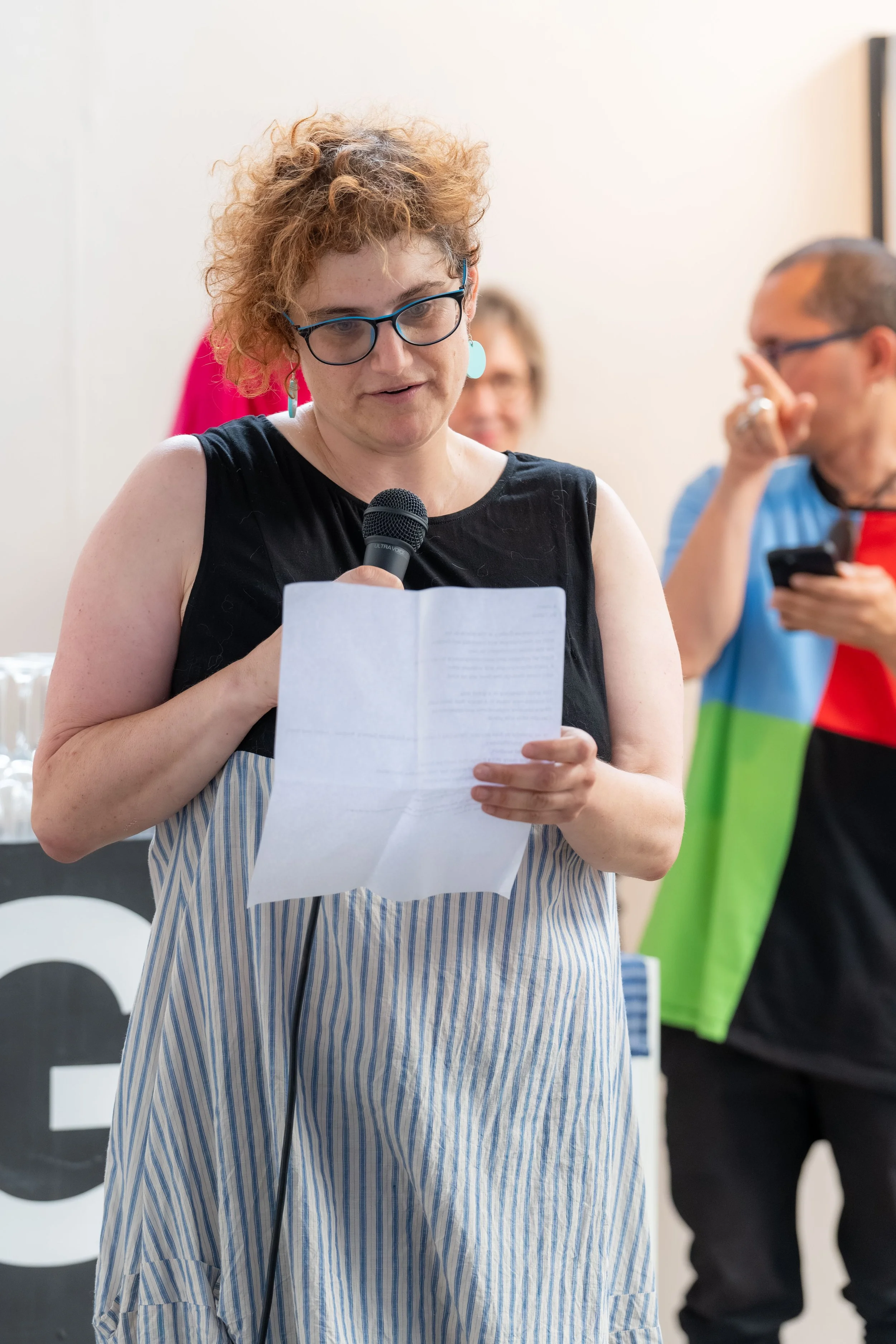 Tamar Dolev gives a speech.