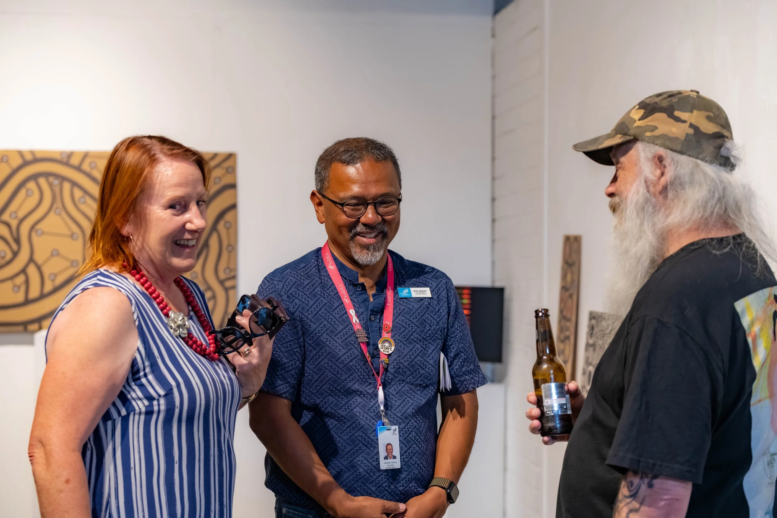 Three humans chat together.