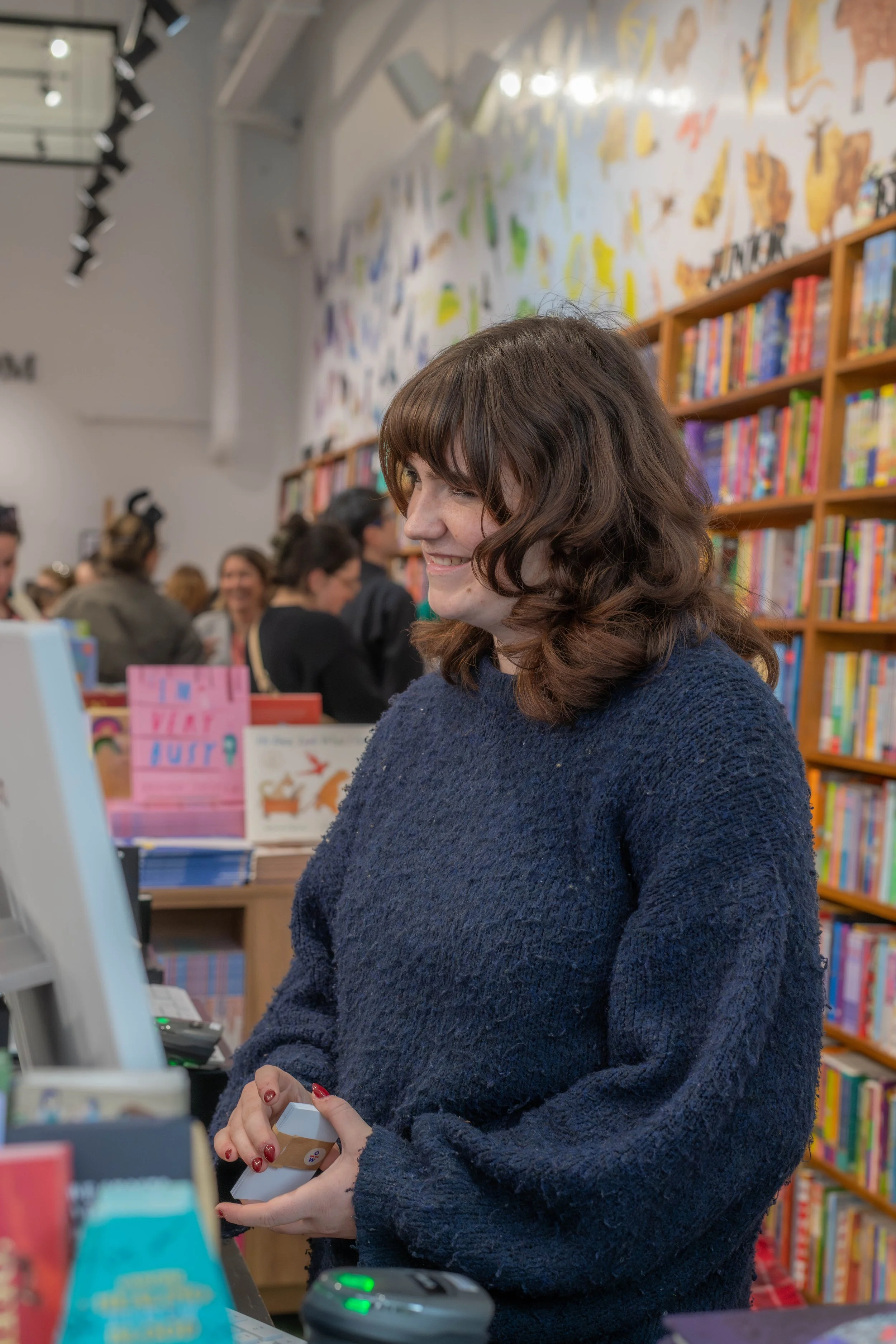 One of the staff members smiles as they work.