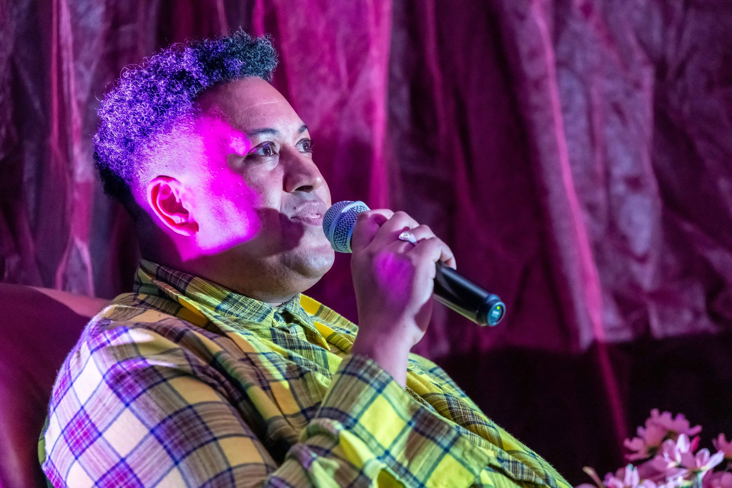 Samuel Gaskin speaks into a microphone.