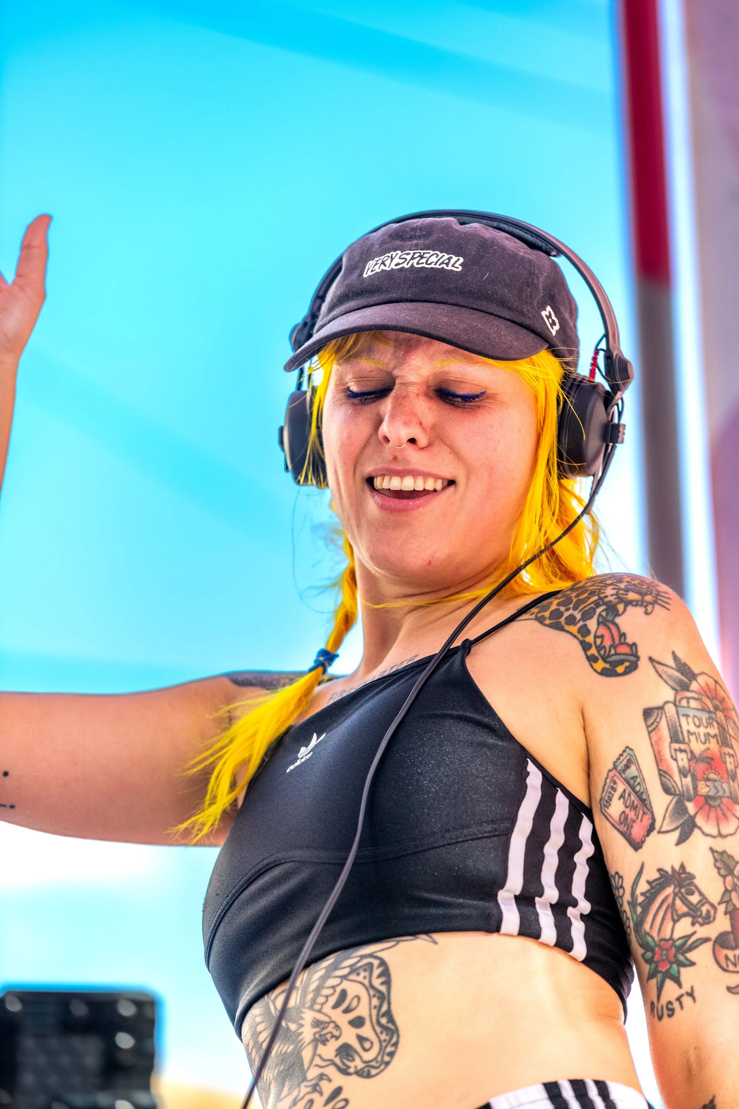 DJ Ya Girl Party B has yellow hair and dances.