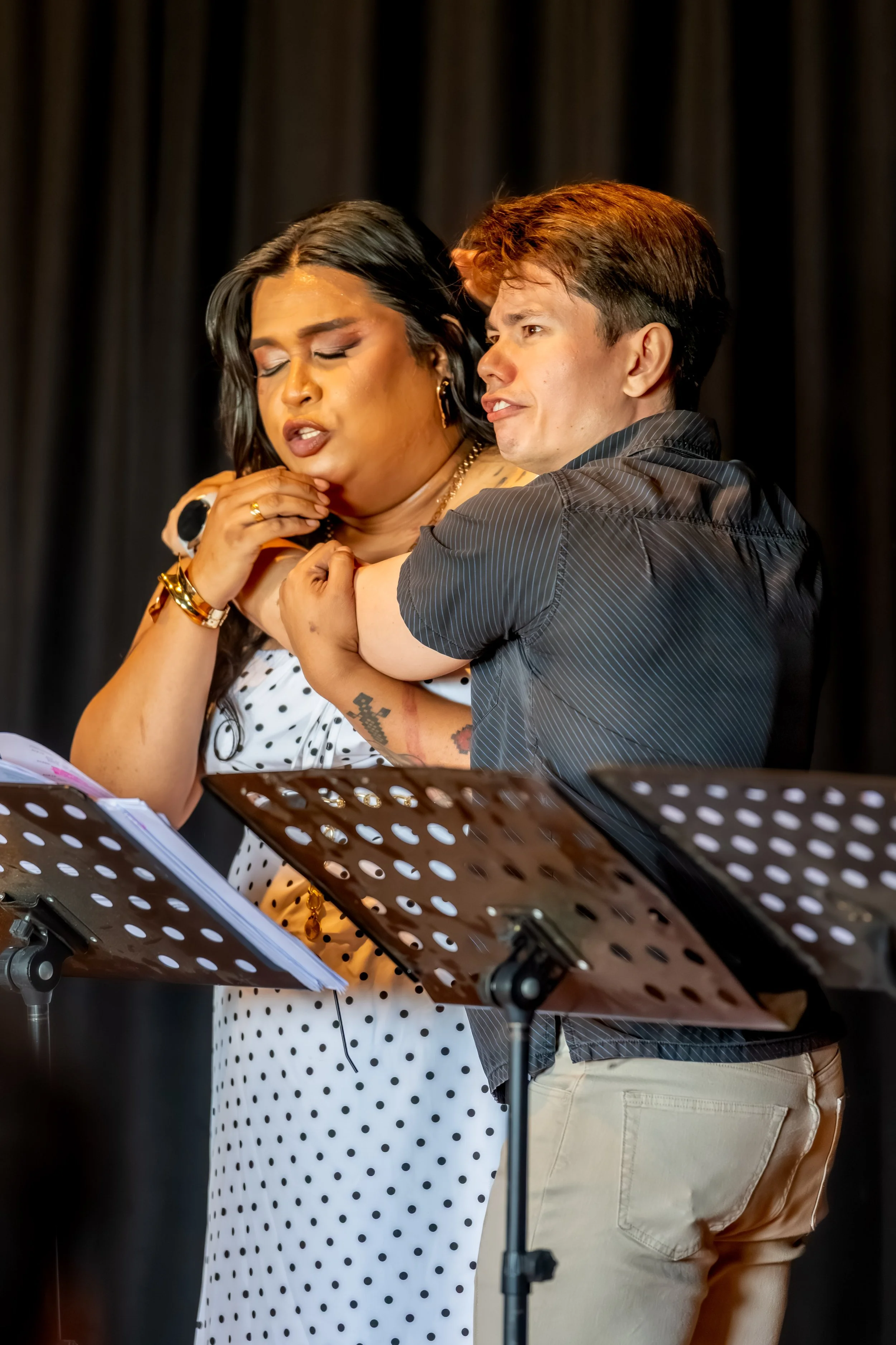 Two humans holding each other.