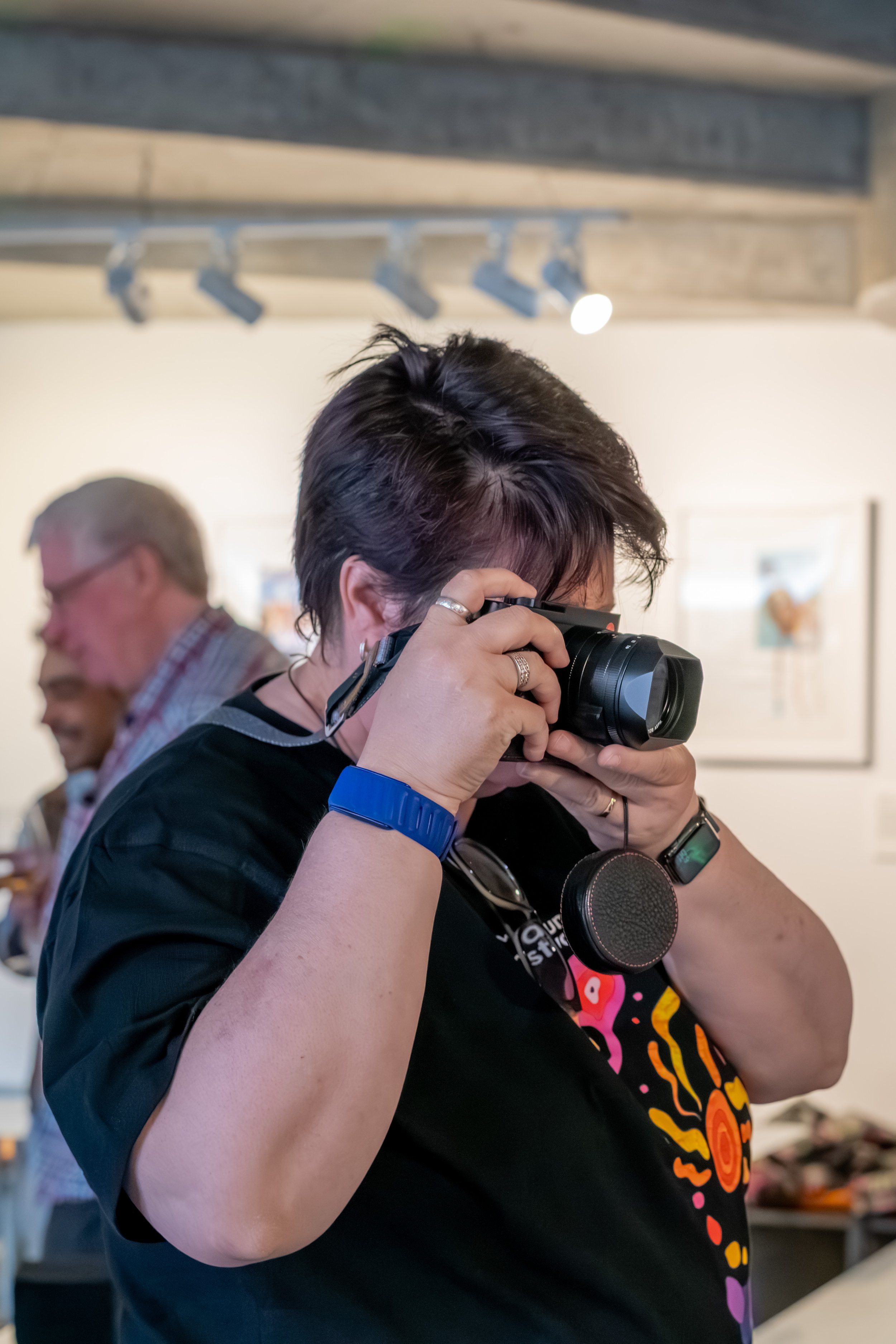 A human takes a photo through their camera.