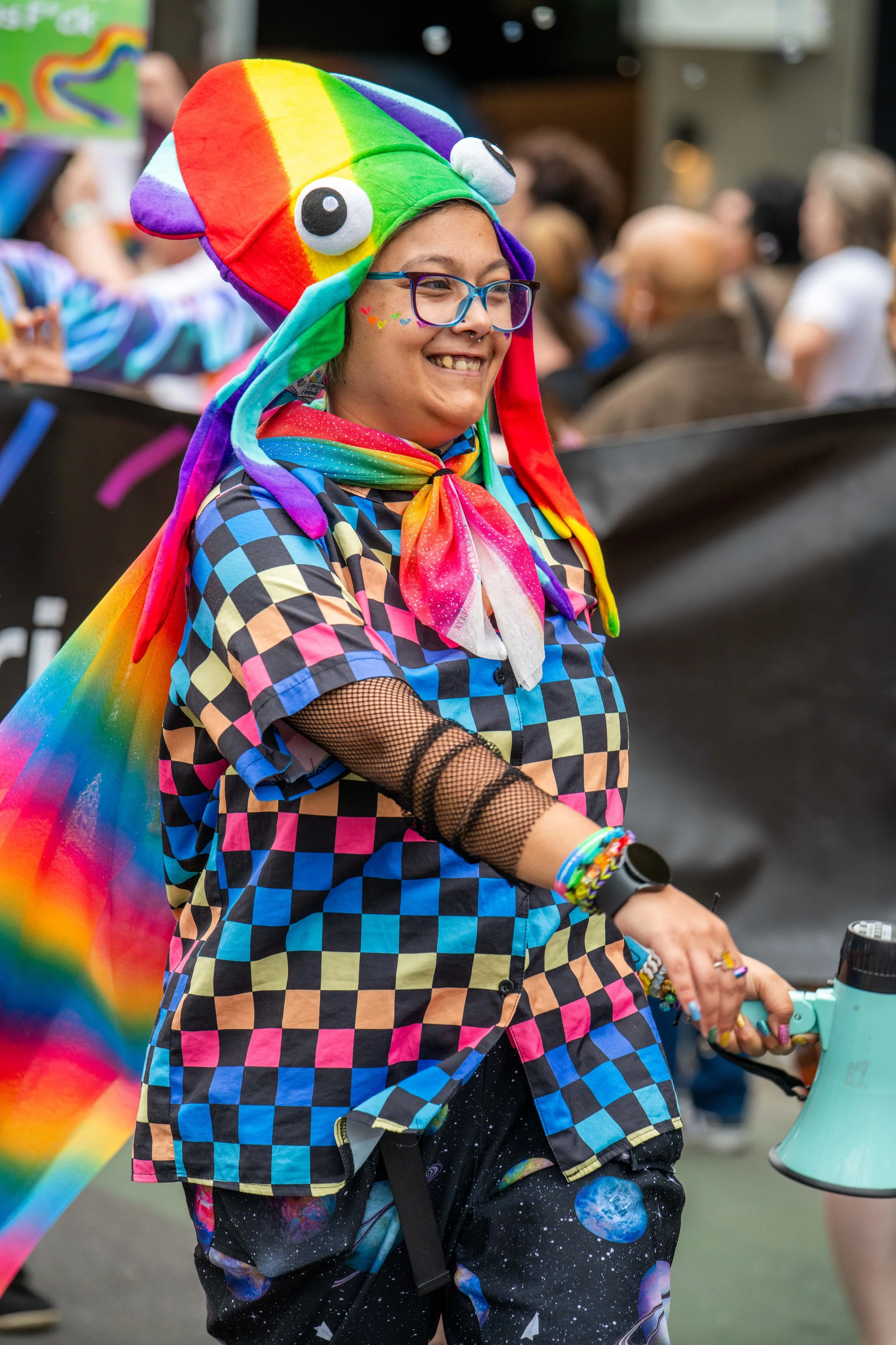 A human dressed all in rainbow.