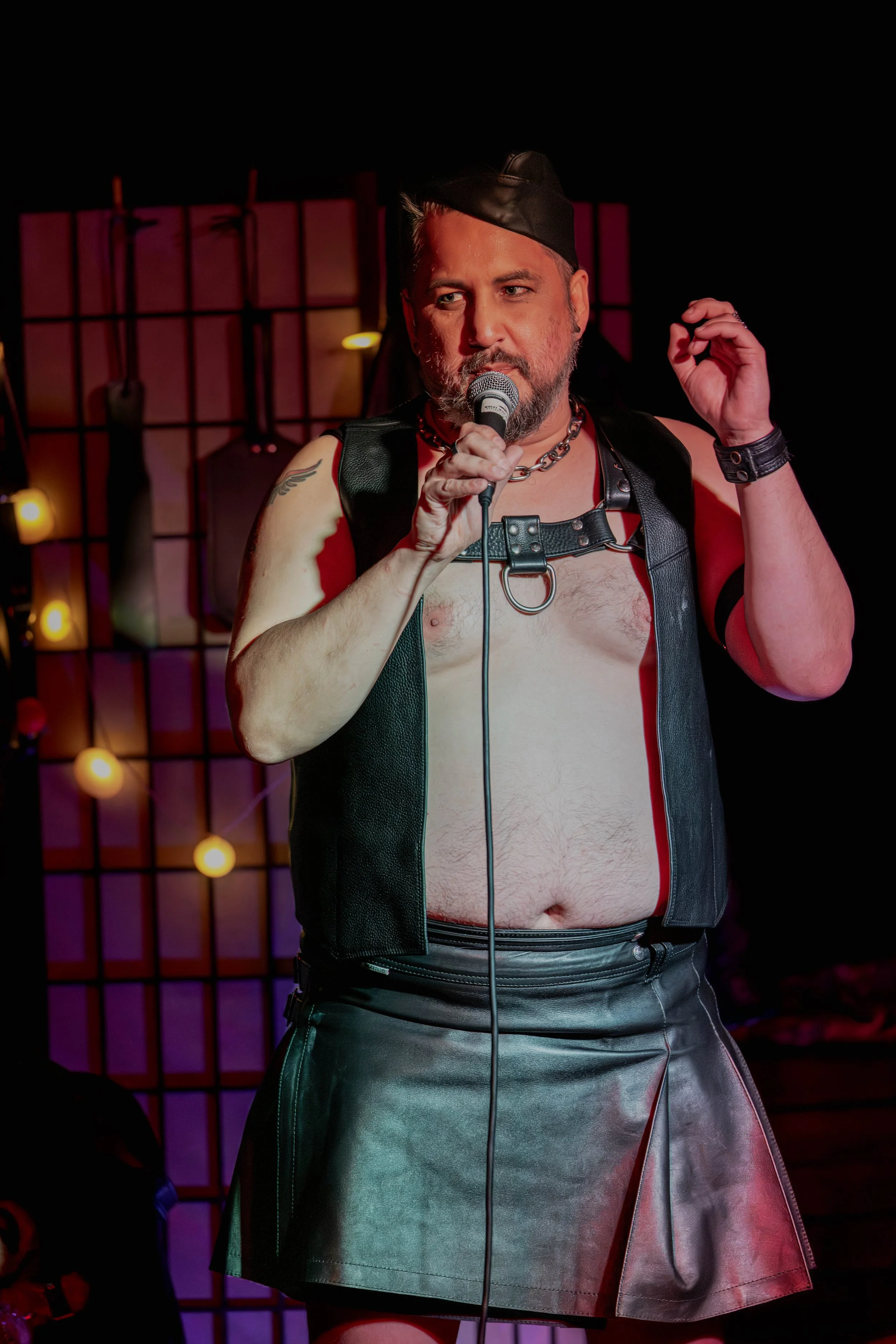 Andrew Rose speaks into a microphone.