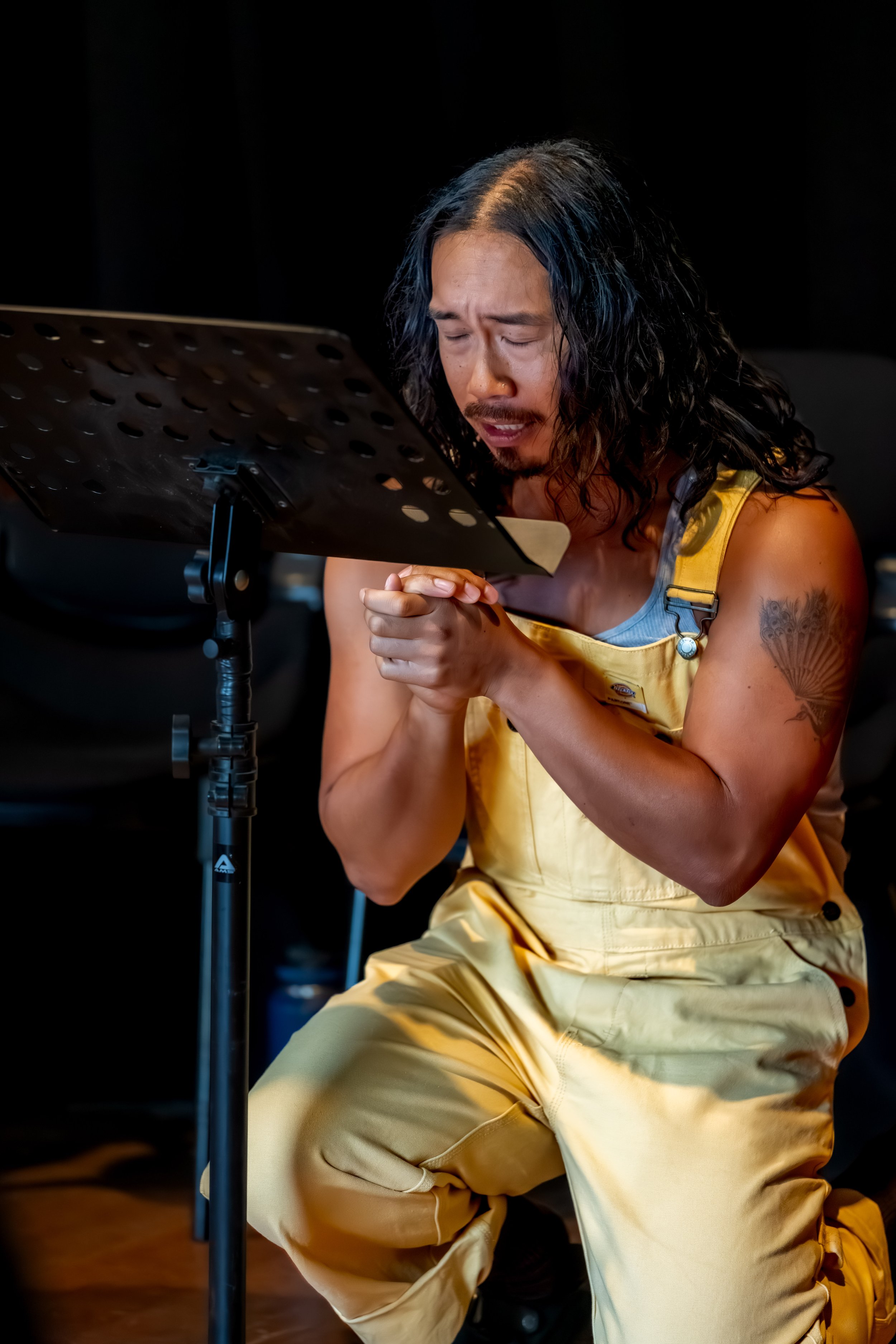 A human taking a knee and praying.