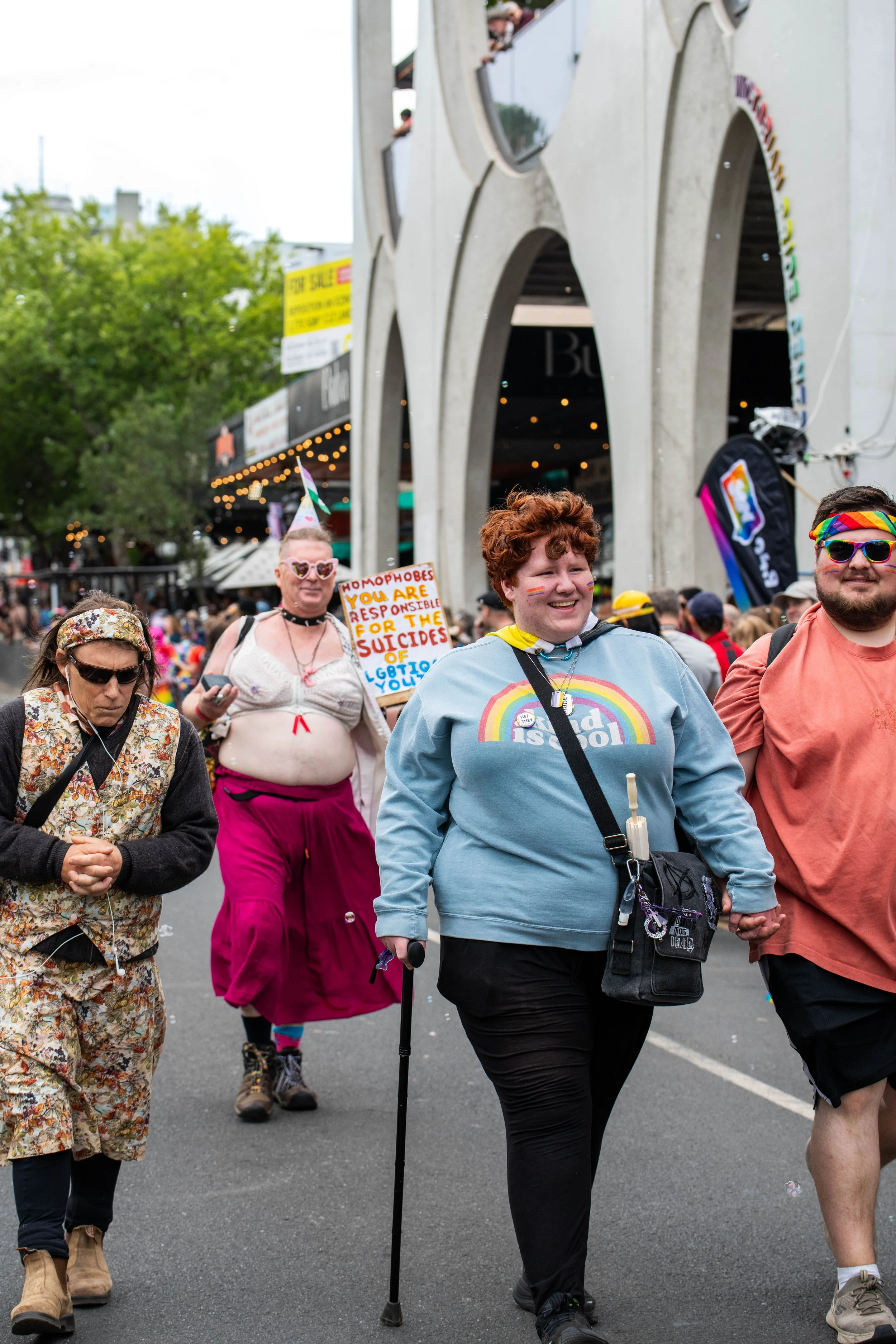 A human with a cane marching.