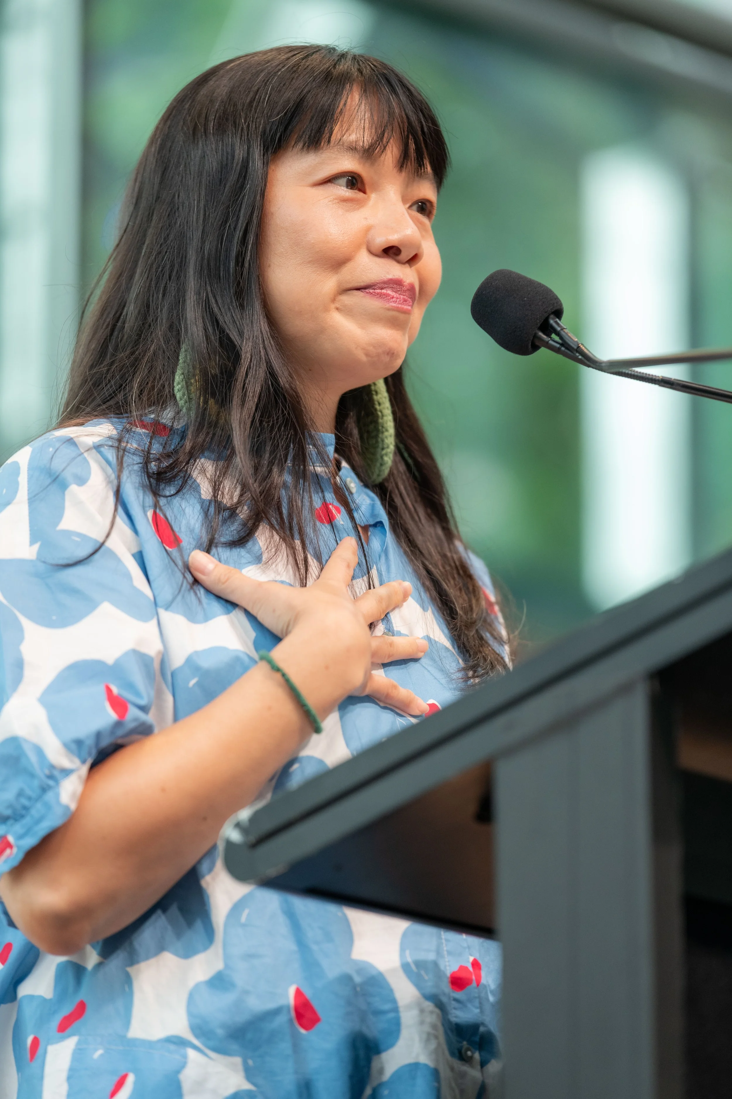 Dr Ee Ling Quah places a hand on their chest.