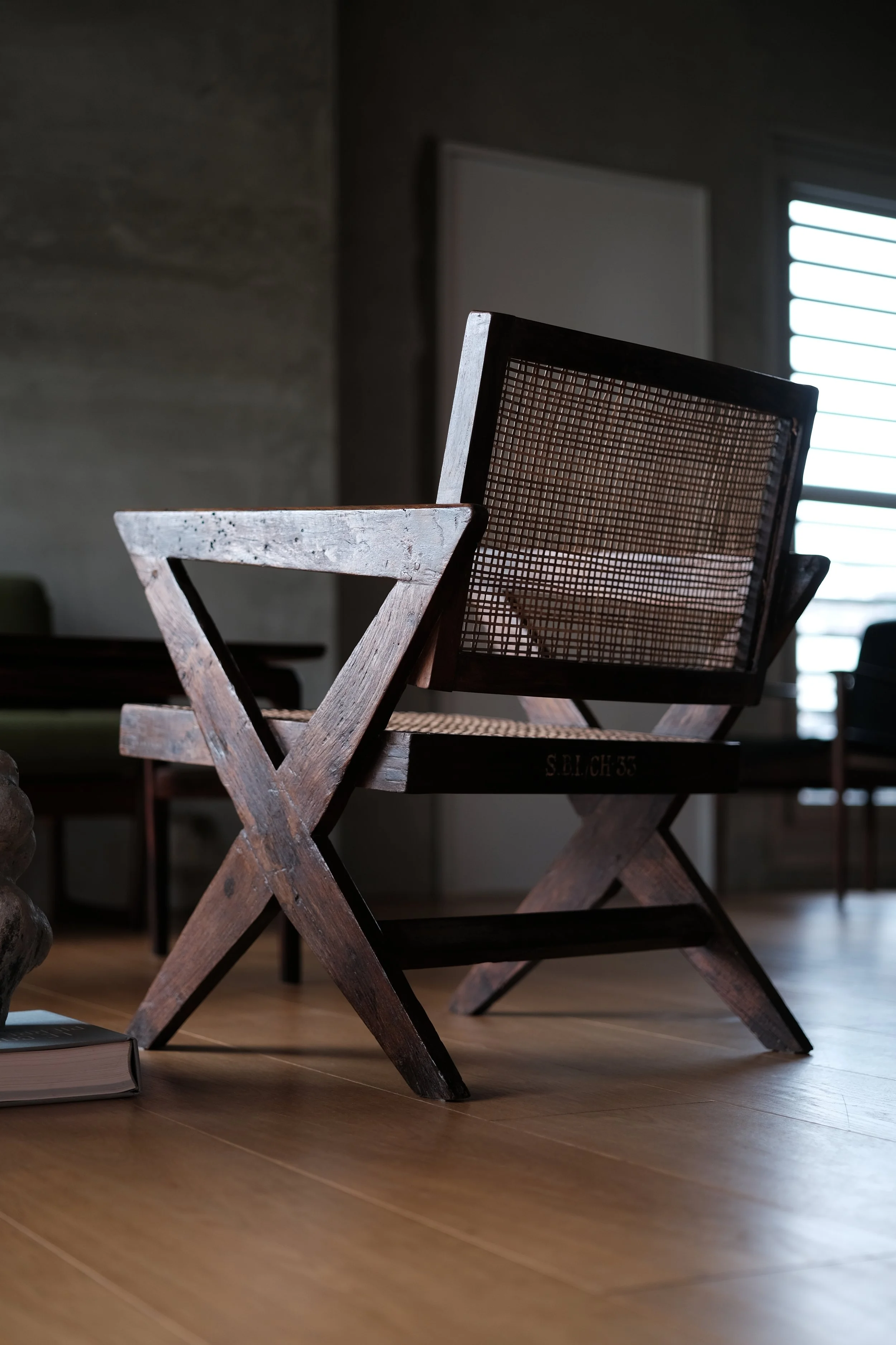 Pierre Jeanneret, A pair of X-leg easy chairs in rosewood for State Bank of India, Chandigarh (1960s)
