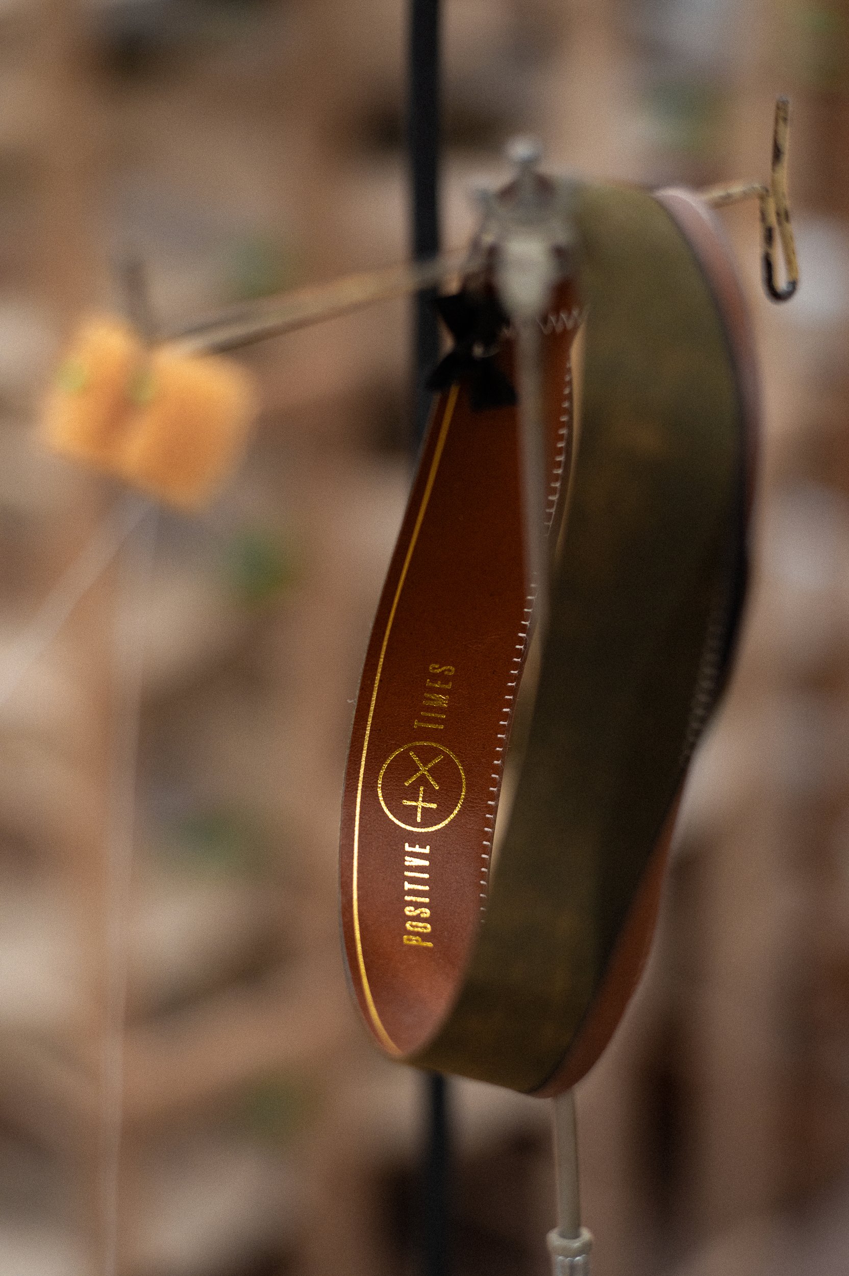Close-up view of a american hat company inner lining showing the Positive times brand