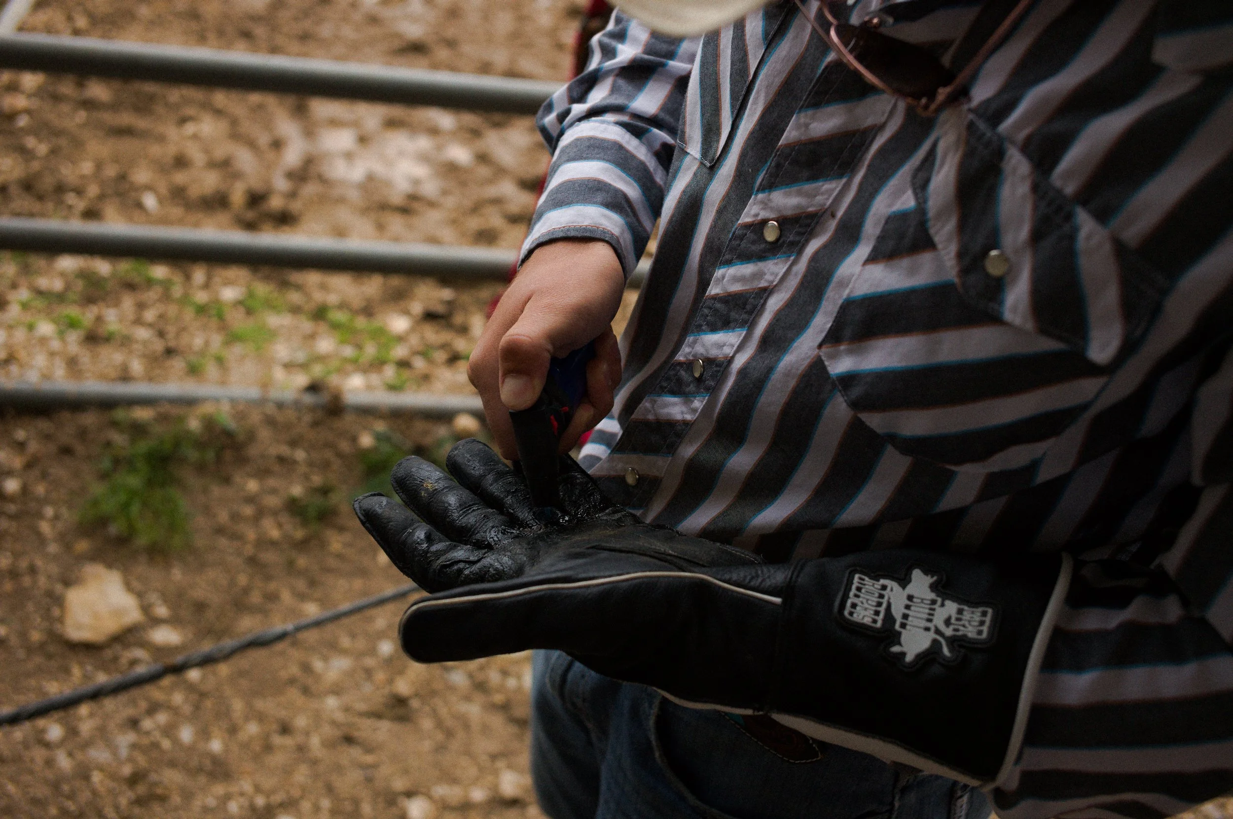 Bulverde Texas - Cowboy melts wax for bullriding